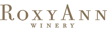 Logo of RoxyAnn Winery with green and brown text on a white background.