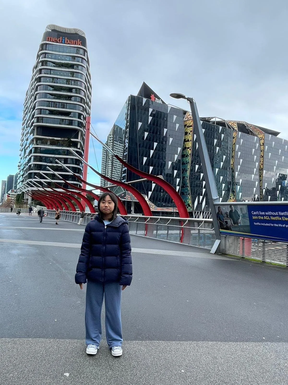 Yuzi Li in front of the Medibank Building in in the Docklands precinct of Melbourne, Victoria.