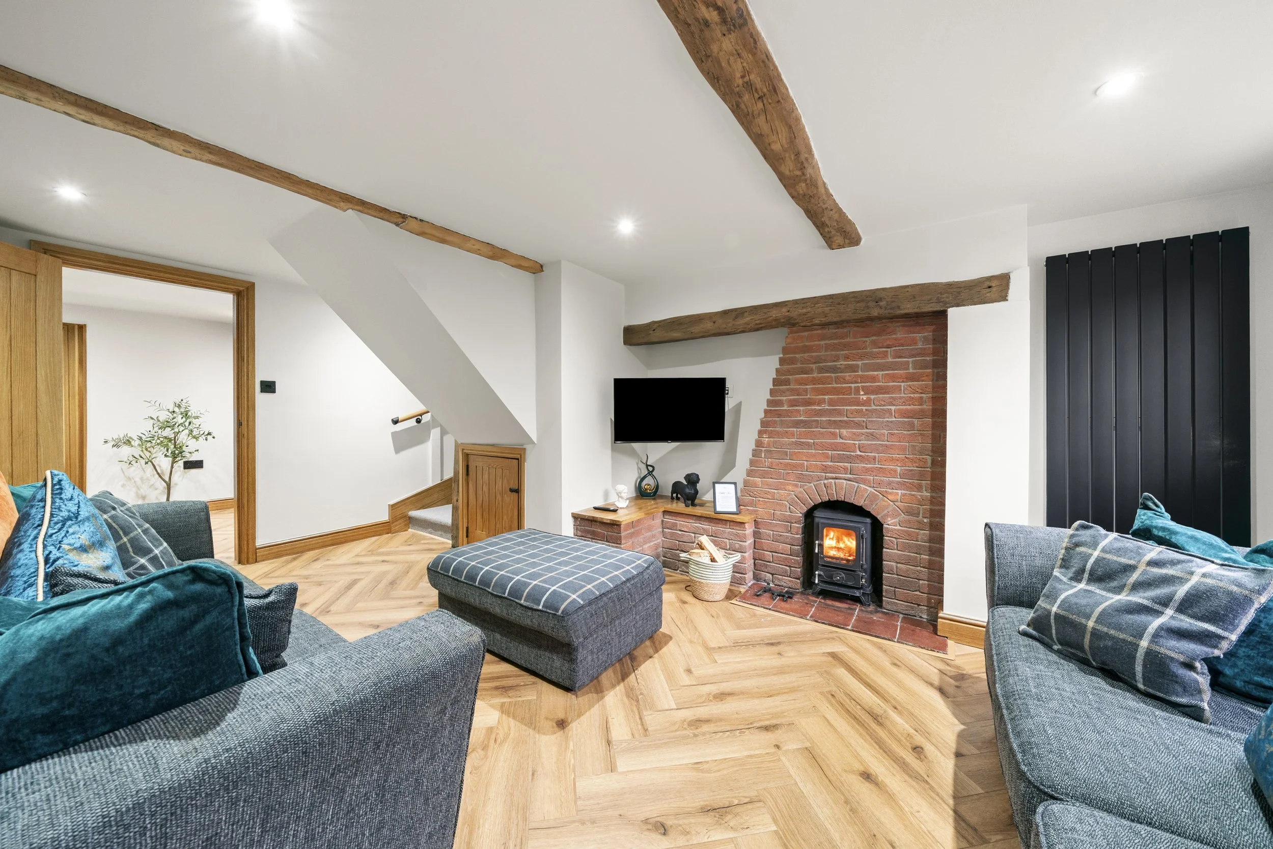 Lounge with log burner at Blacksmith Cottage, Staffordshire