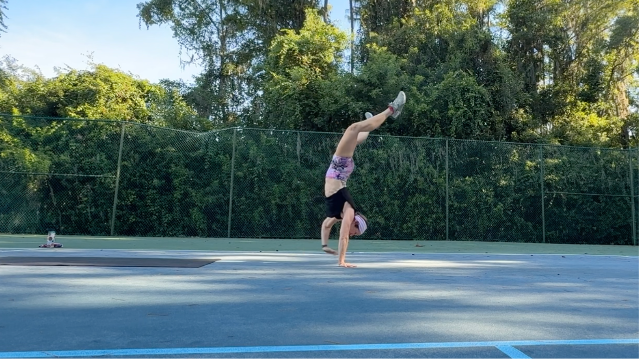 Dr B doing a handstand walk at 50 years old