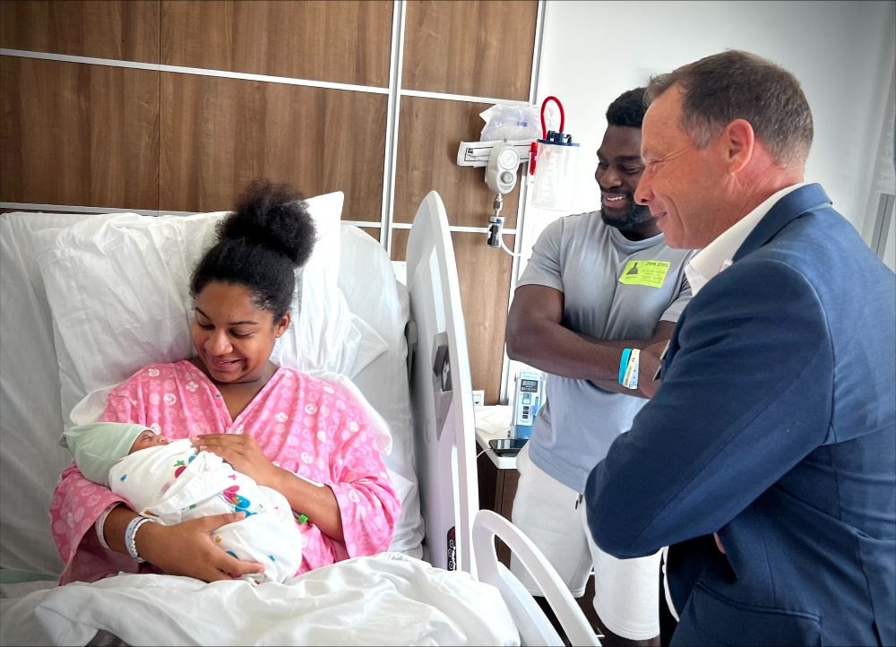 A Blanket and a College Scholarship for the First Born at New Hospital