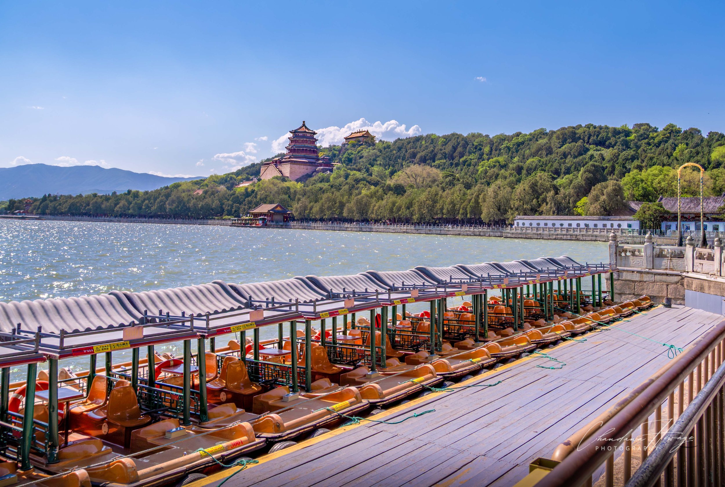 Kunming Lake and the Longevity Hill in the background. Kunming Lake covers 75% of the estate and is entirely man-made: hundreds of thousands of laborers manually excavated and widened an existing marshy pond during the Qianlong Emperor's reign. The e