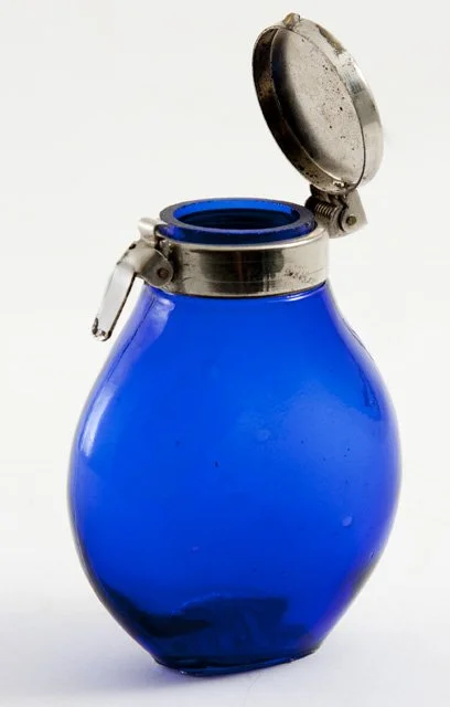 A pocket sputum flask from circa 1920. A sputum flask would have served as a place for those suffering from tuberculosis to spit without spreading disease (Accession Number 19692531).