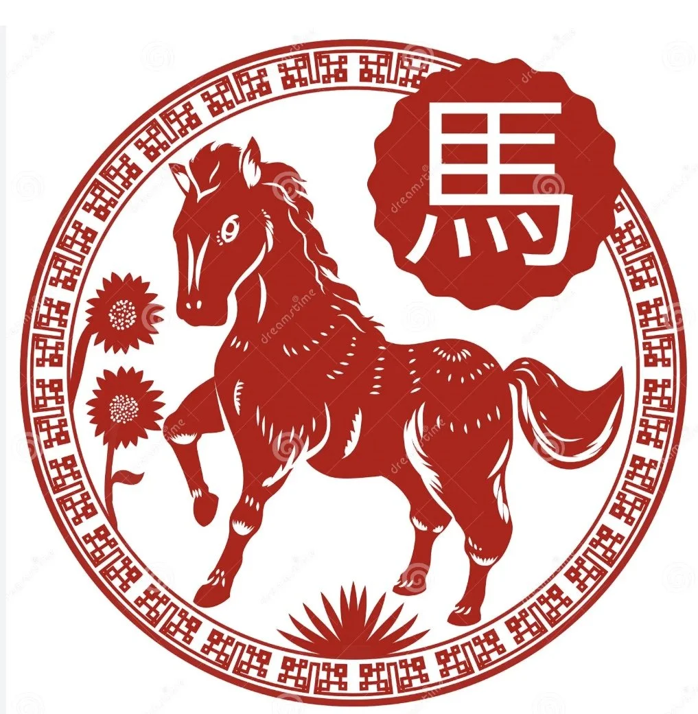 Red and white Chinese-style paper cut-out illustration of a horse with flowers and a circular border, featuring a large Chinese character within a red scalloped shape.