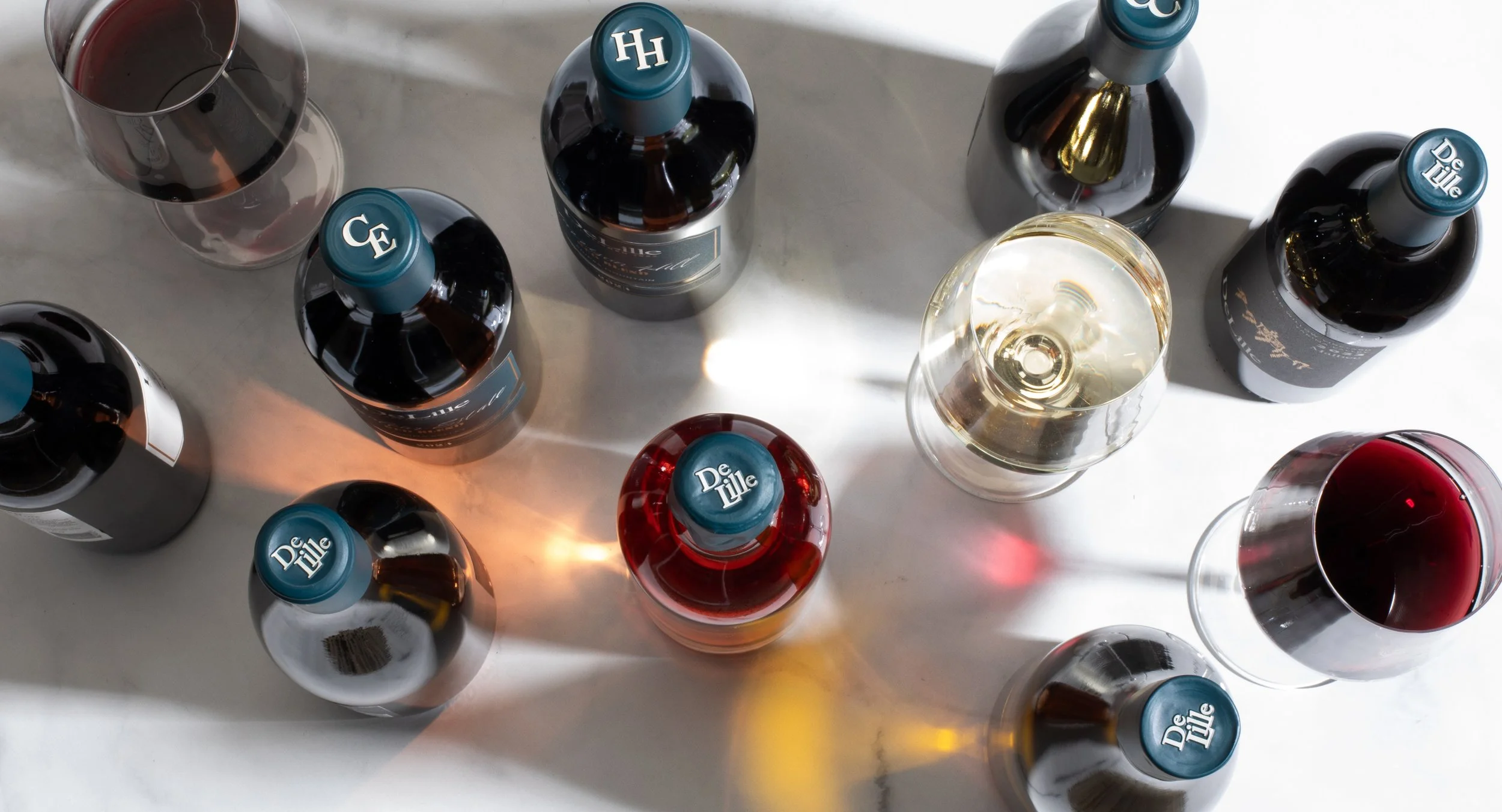 Branding & Packaging Design for DeLille Cellars. Project included brand strategy, positioning, brand guidelines & asset development and wine label / packaging design.