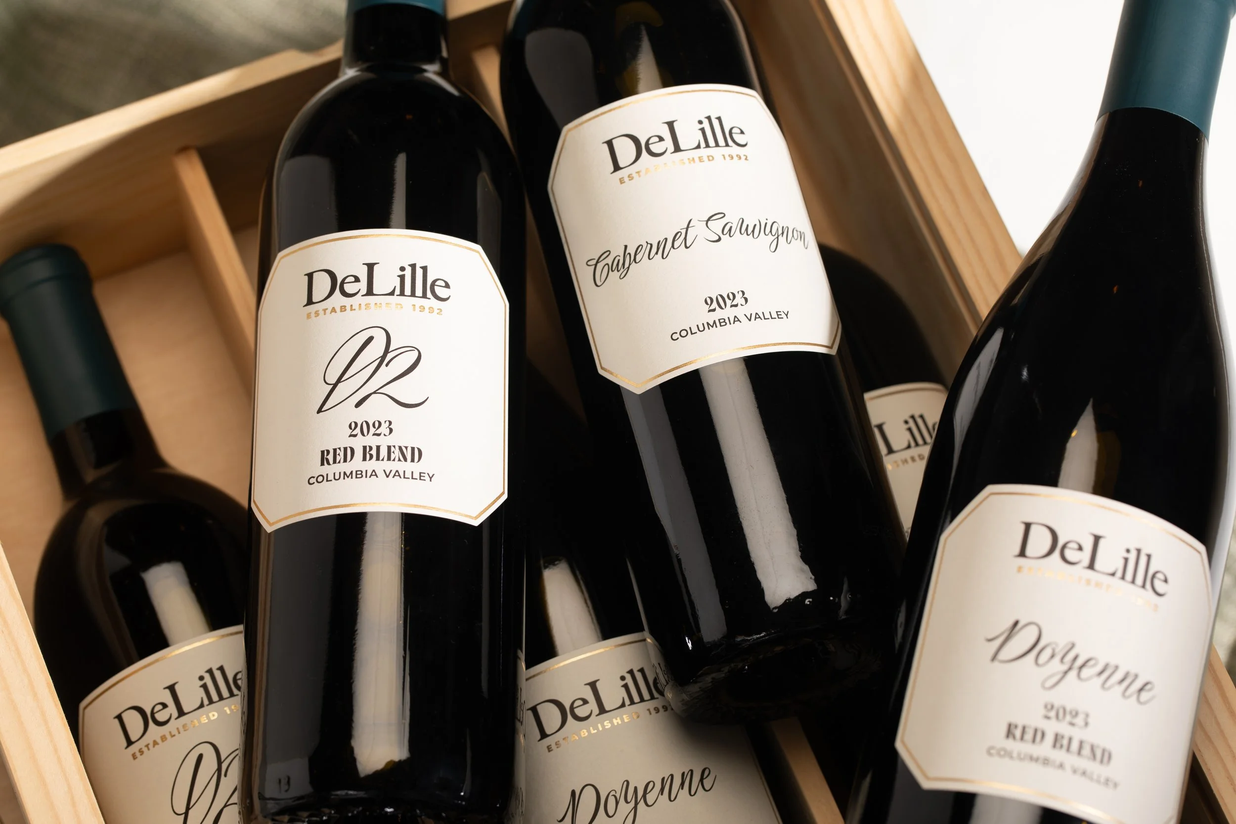 Branding & Packaging Design for DeLille Cellars. Project included brand strategy, positioning, brand guidelines & asset development and wine label / packaging design.