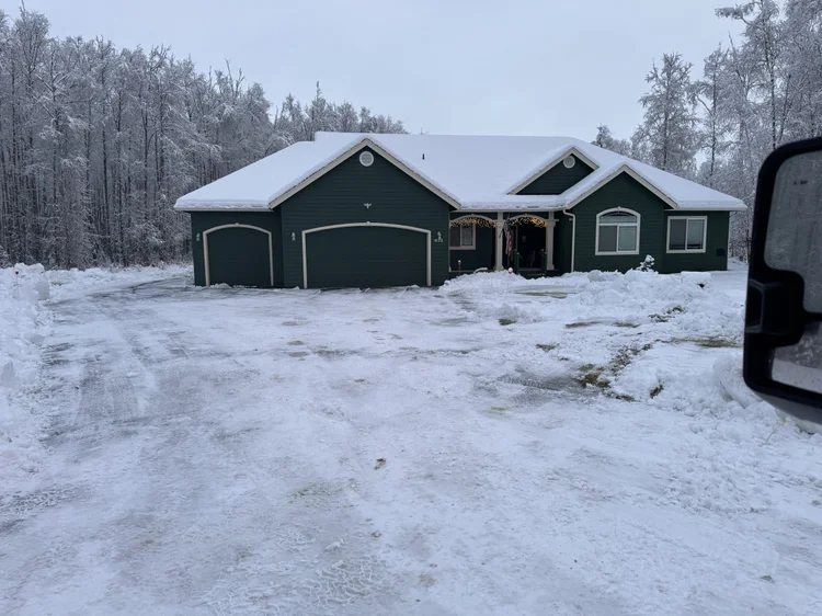 Green house driveway plowed in Wasilla