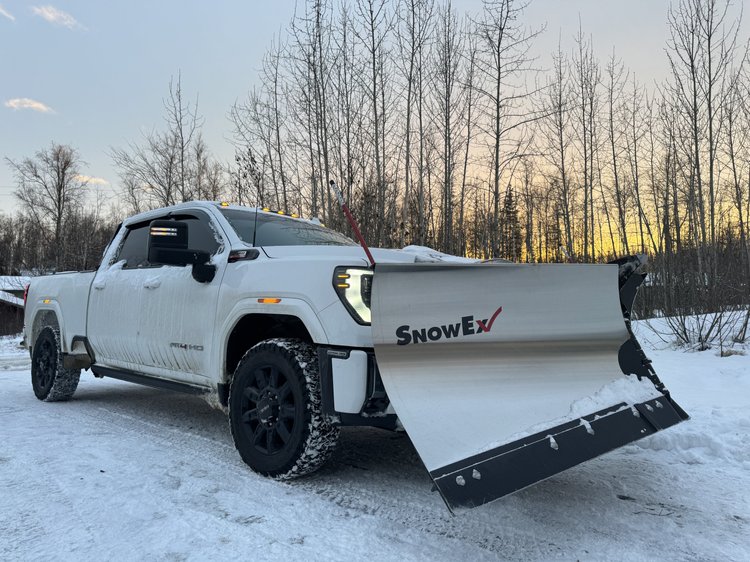 Snip and Clip plow truck at sunset on the winter route