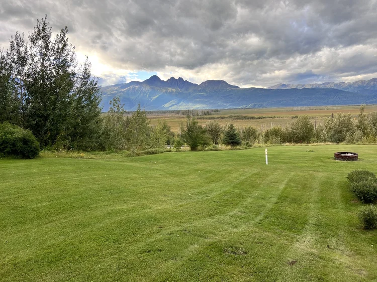 Mowing with a gorgeous mountain backdrop