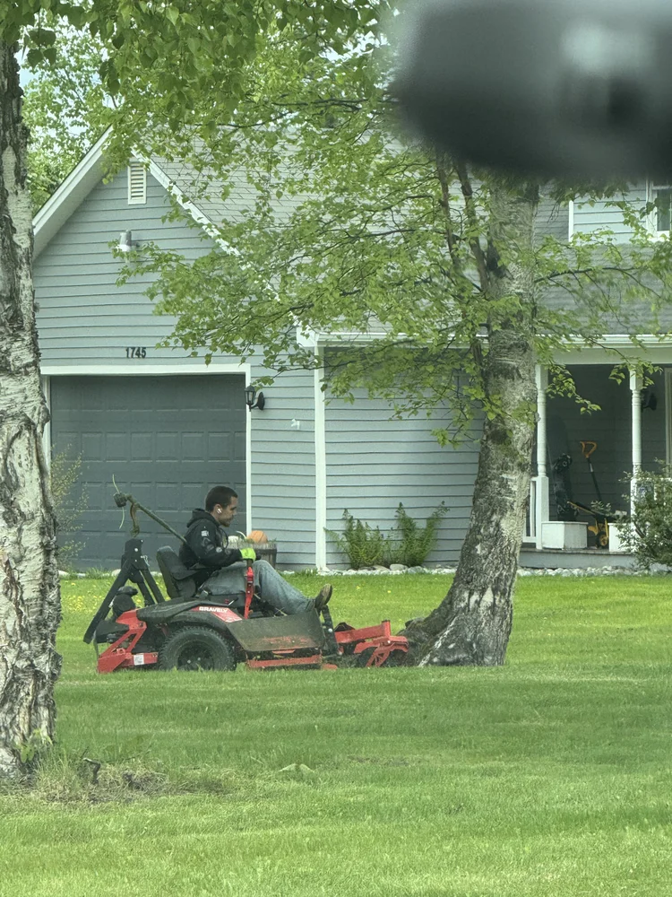 Crew member mowing in Palmer