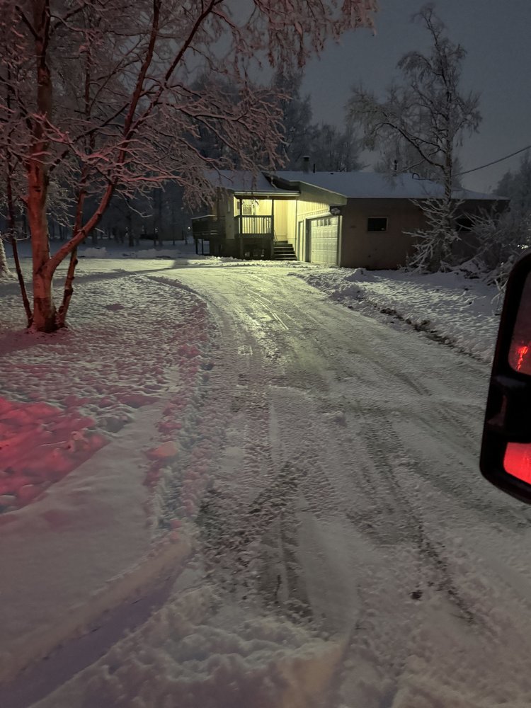 Residential driveway after plowing was completed