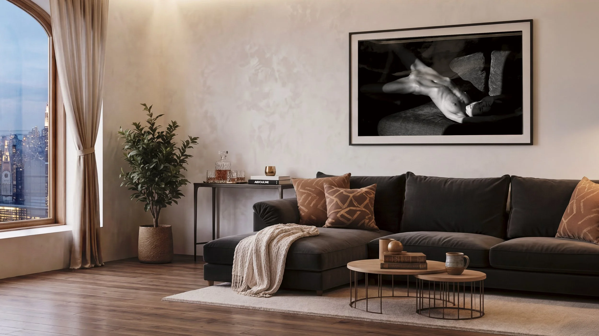 Living room with large window, beige curtains and city view, black sectional sofa with brown throw pillows, beige blanket, round wooden coffee tables, potted plant, wall art, and wood flooring.