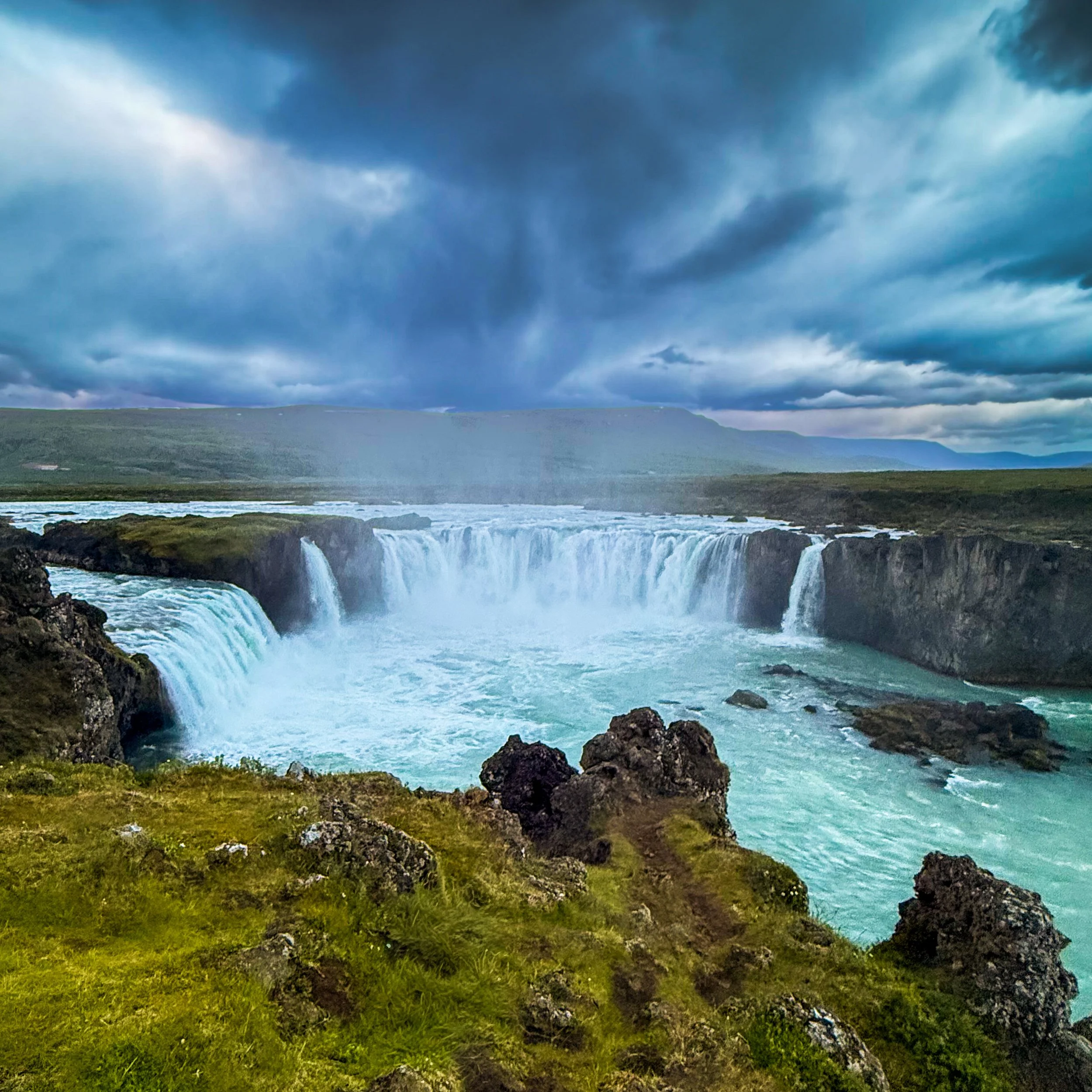 Goðafoss is a waterfall in northern Iceland. It is located along the country's main ring road at the junction with the Sprengisandur highland road, about 45 minutes from Akureyri. The water of the river Skjálfandafljót falls from a height of 12 meter