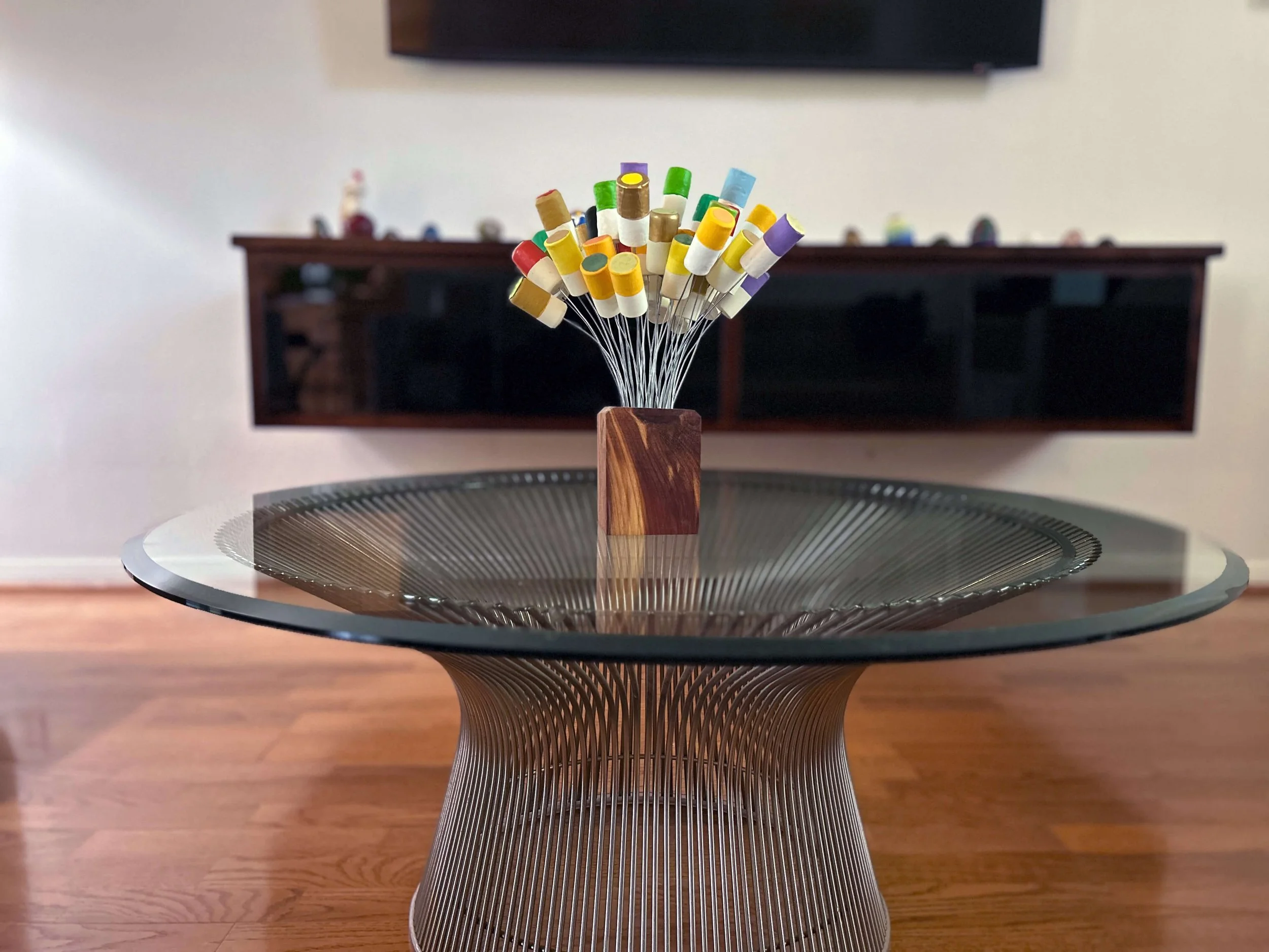 reclaimed wood block with wire stems and multicolored wine cork tips, arranged like a small bouquet