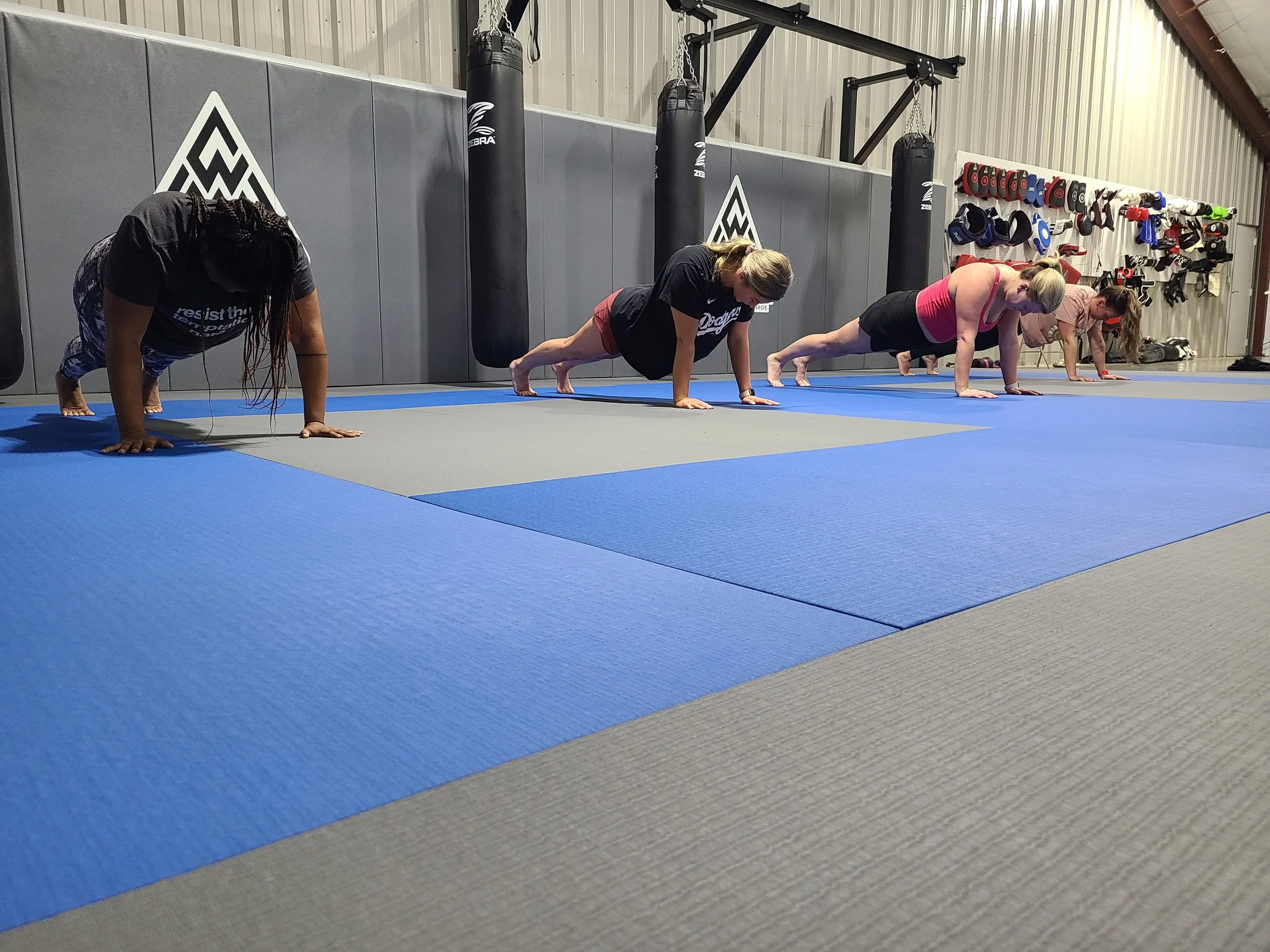 Geometric drawing of an outline square with sections divided by vertical, horizontal, and circle lines.