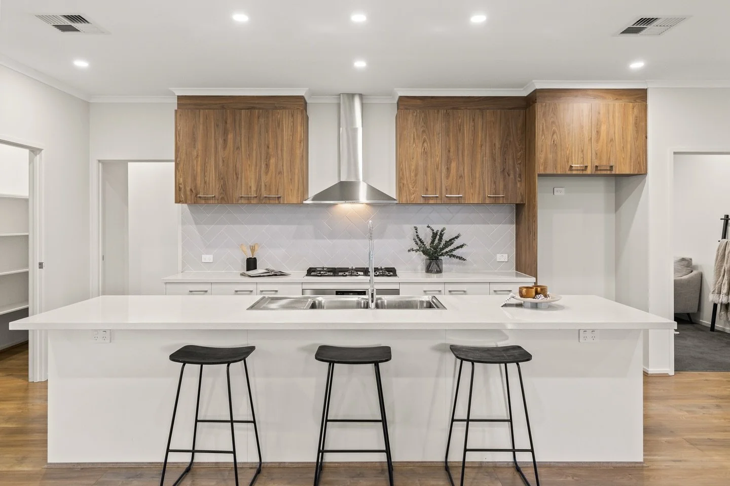 Clean lines. Open space. Timeless finishes.

This modern open plan kitchen brings it all together with stainless steel appliances, seamless flow and a layout designed for everyday living and entertaining. Bright natural light, functional design and a
