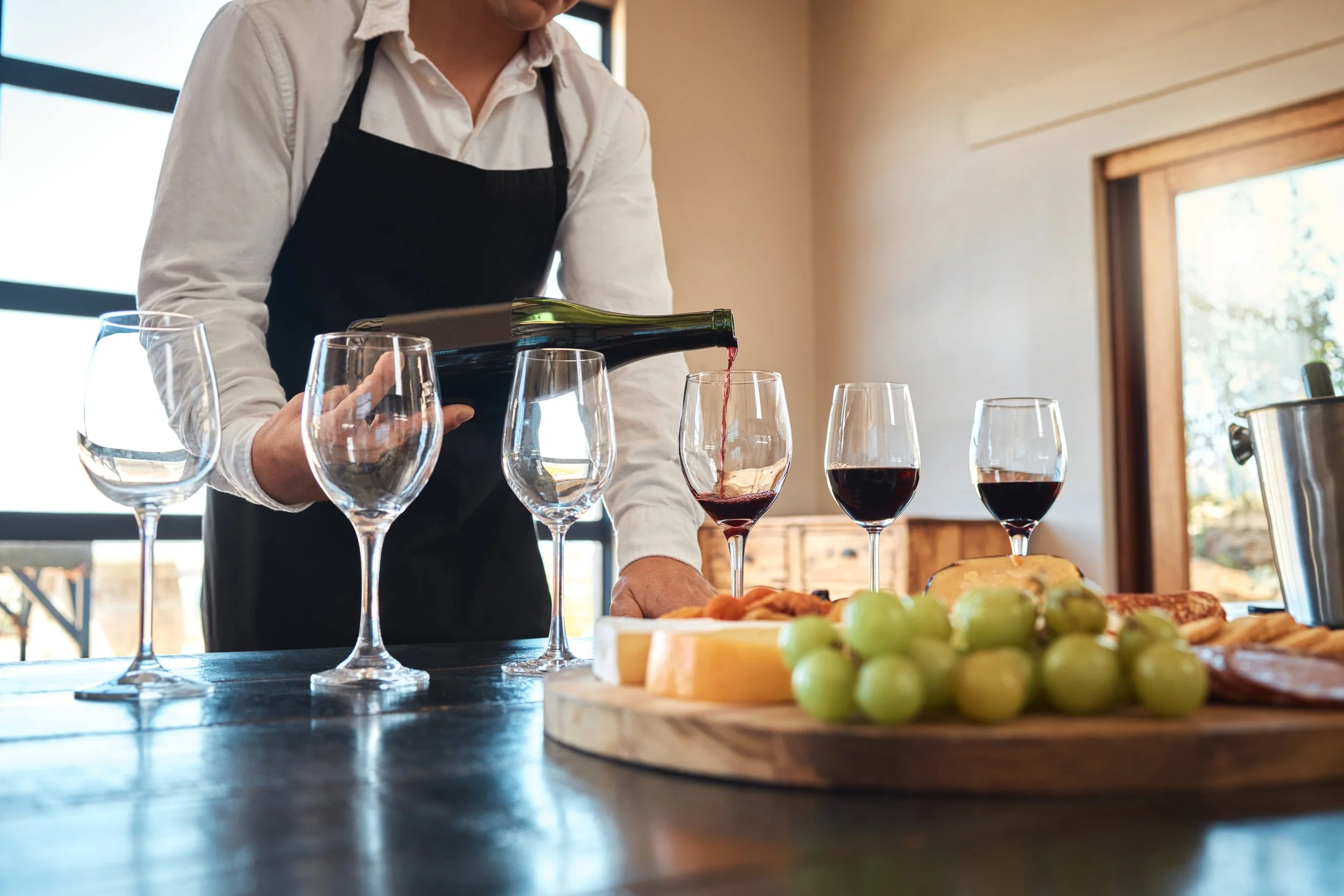 hospitality-industry-luxury-wine-service-with-waiter-pouring-glasses-prepare-wine-tasting-restaurant-professional-sommelier-setting-up-fine-dining-experience-with-alcohol.jpg