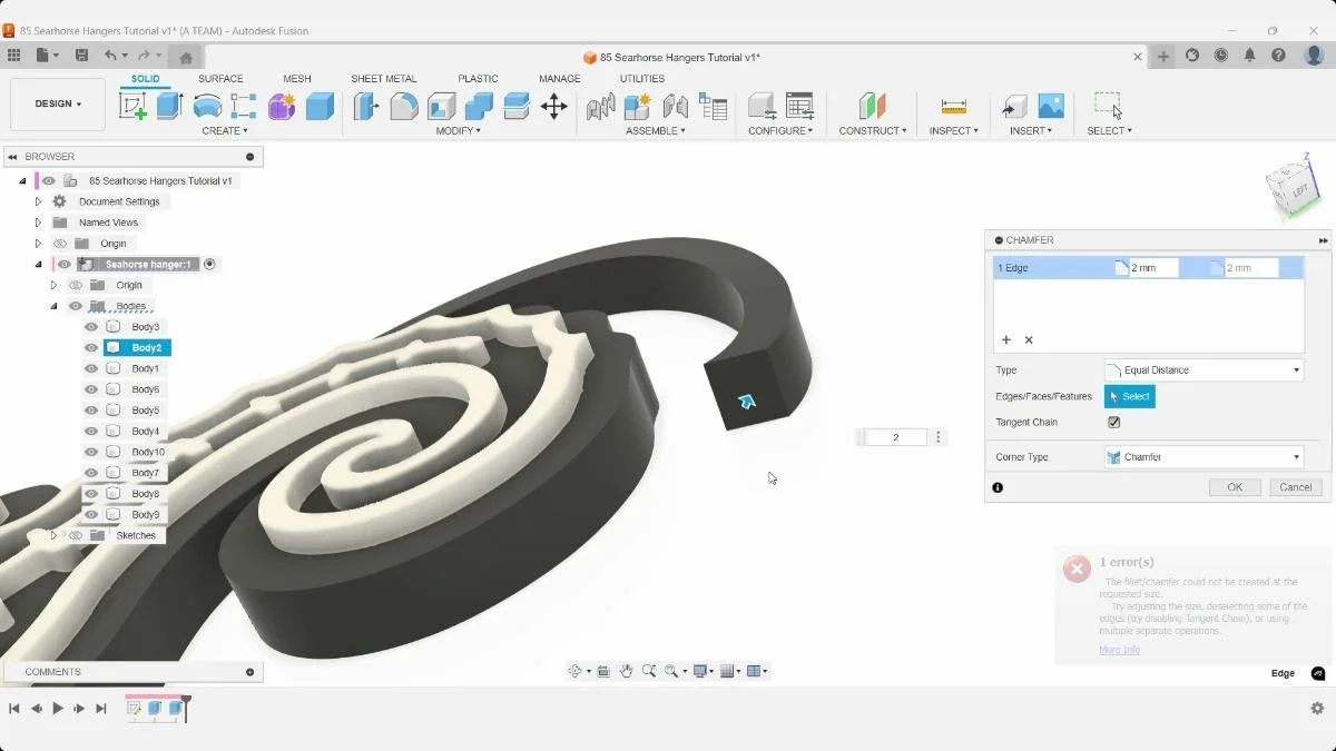 Fusion Chamfer dialog beside a selected edge of the seahorse hanger.