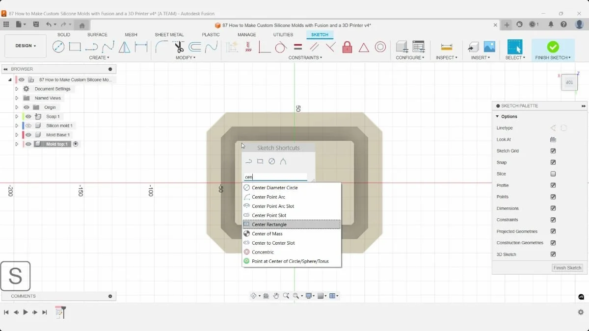 Fusion Sketch Shortcuts menu with Center Rectangle selected above the mold base in top view.