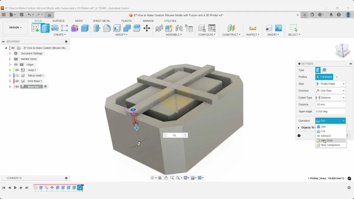 Fusion previews a downward alignment-pin extrusion from a mold-top support, with −15 mm entered.