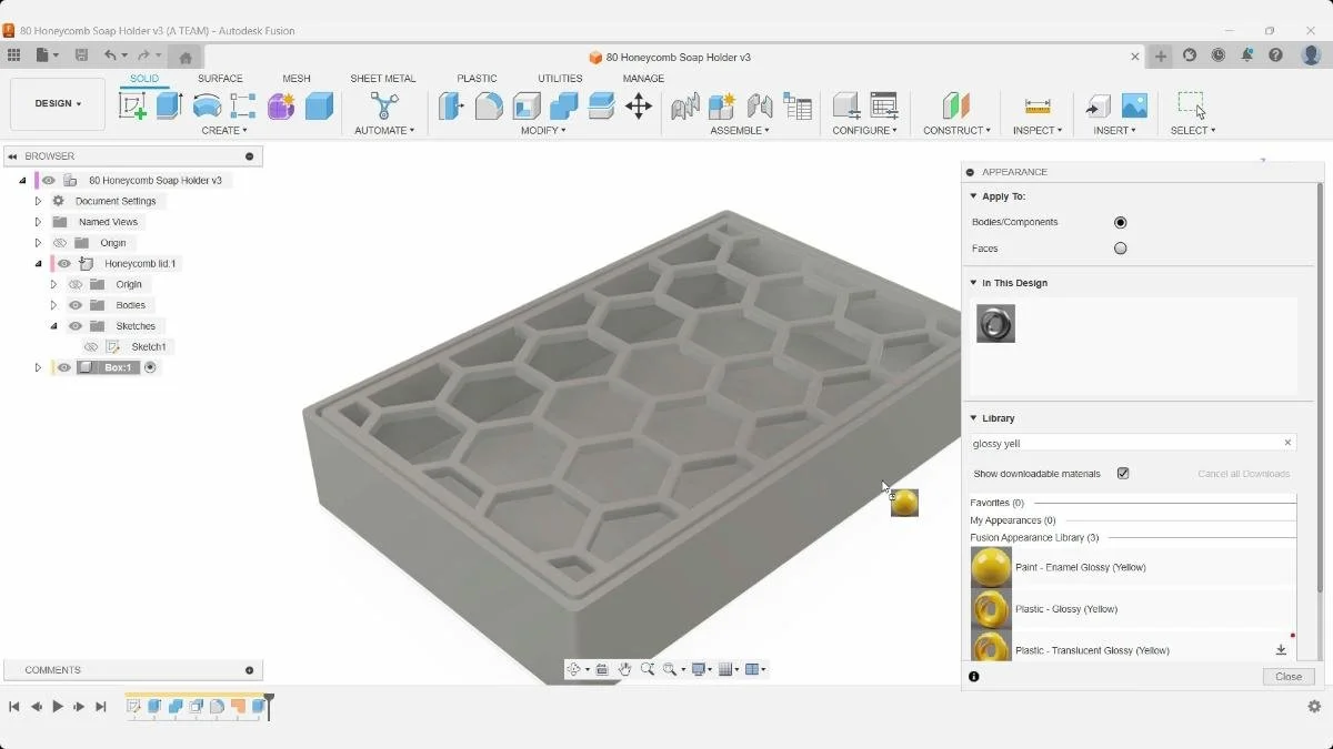 Fusion Appearance panel applying a yellow glossy material to the honeycomb soap holder.