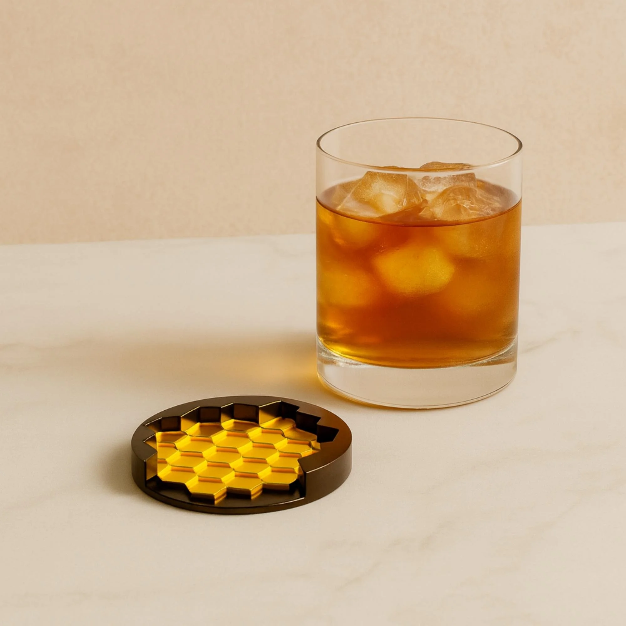 Bright yellow honeycomb-style 3D-printed coaster placed near a glass of iced tea with lemon in a warm lifestyle product render