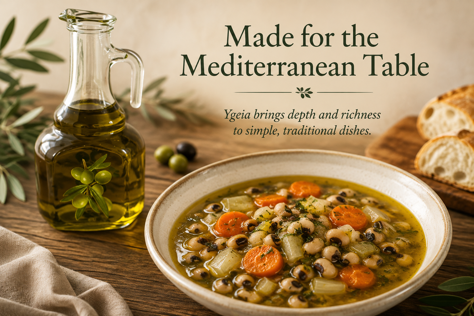 Ygeia Greek extra virgin olive oil in a glass bottle beside a bowl of traditional Mediterranean bean soup, with crusty bread, olives, and olive branches on a rustic wooden table.