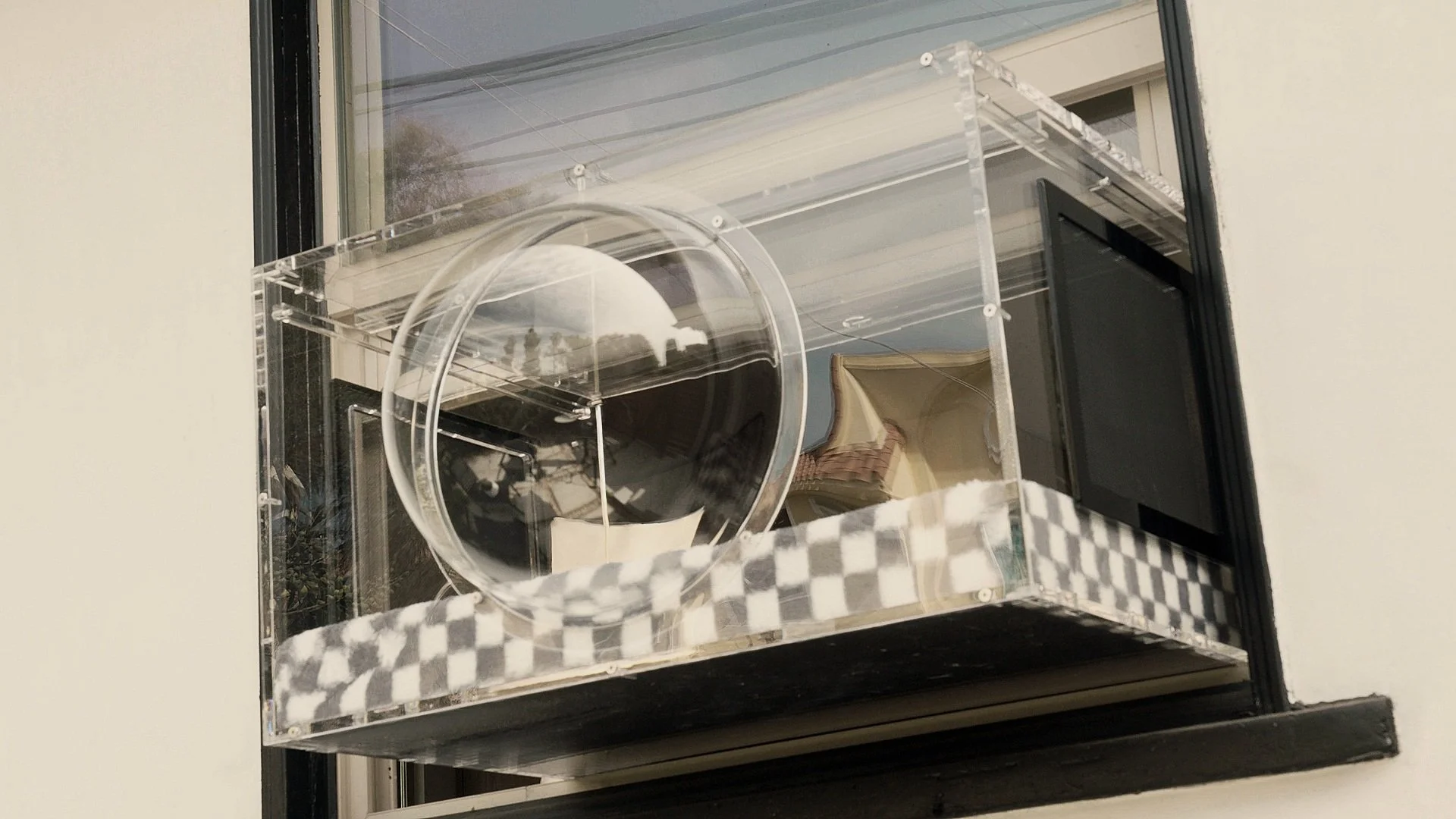 Clear acrylic cat window box with plaid cushion and circular opening. Window Catio. Catio.