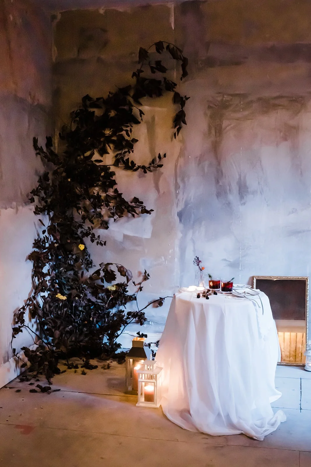 Immersive dried flower installation creating an atmospheric setting for an intimate styled event
