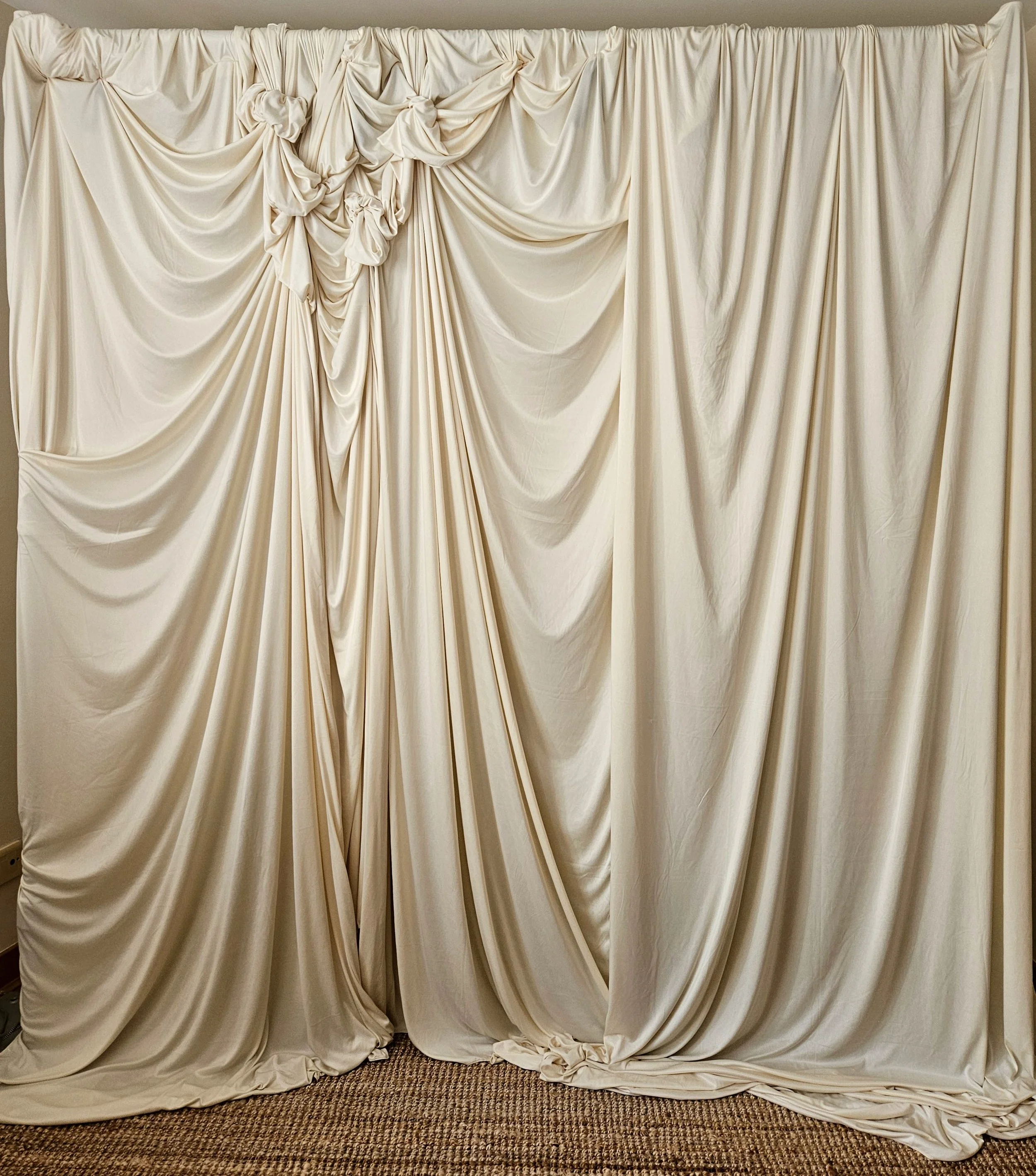 “Bespoke ivory fabric draping and sculptural event backdrop by nàdair studio Edinburgh”