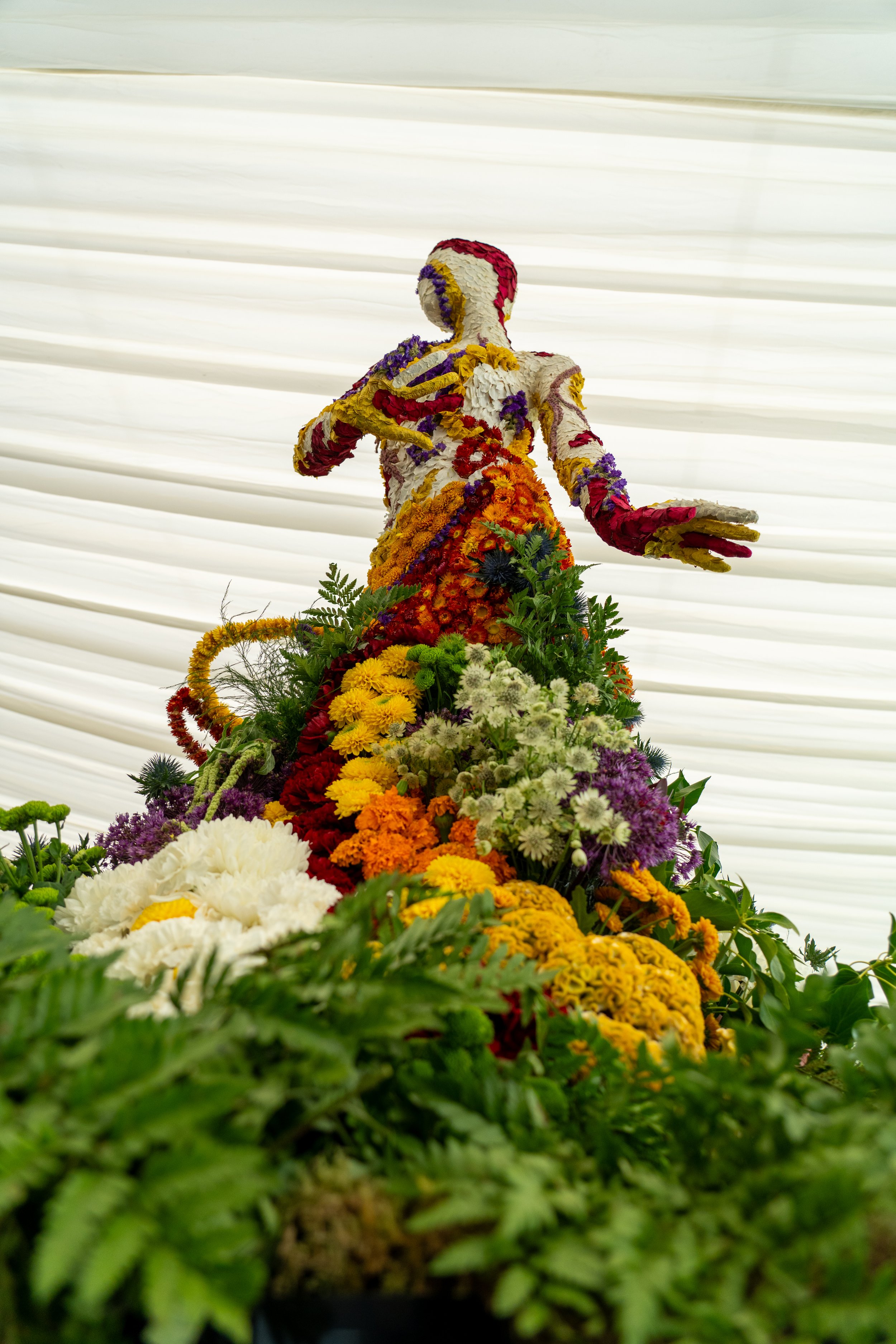 Floral mannequin installation created for Fleurs de Villes at the Royal Botanic Garden Edinburgh, inspired by an artwork by Joana Vasconcelos (Jupiter Artland).