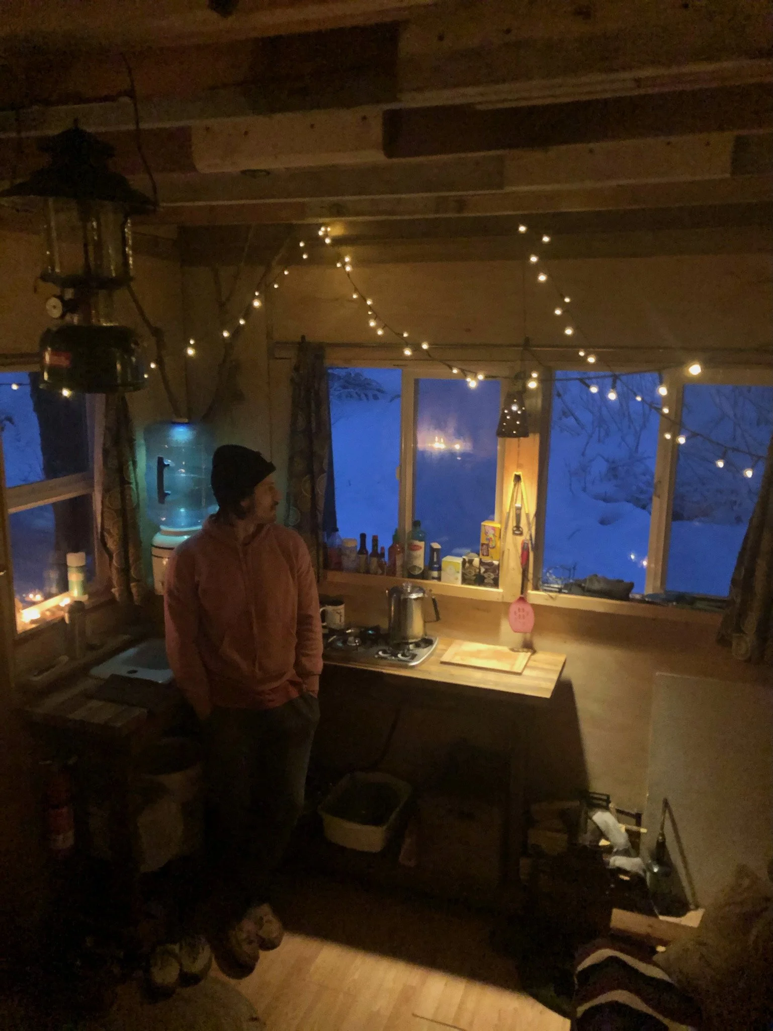 Me on a snowy evening, all lights aglow, woodstove roaring nearby. A perfect night. (Credit: Patrick Hutchison)