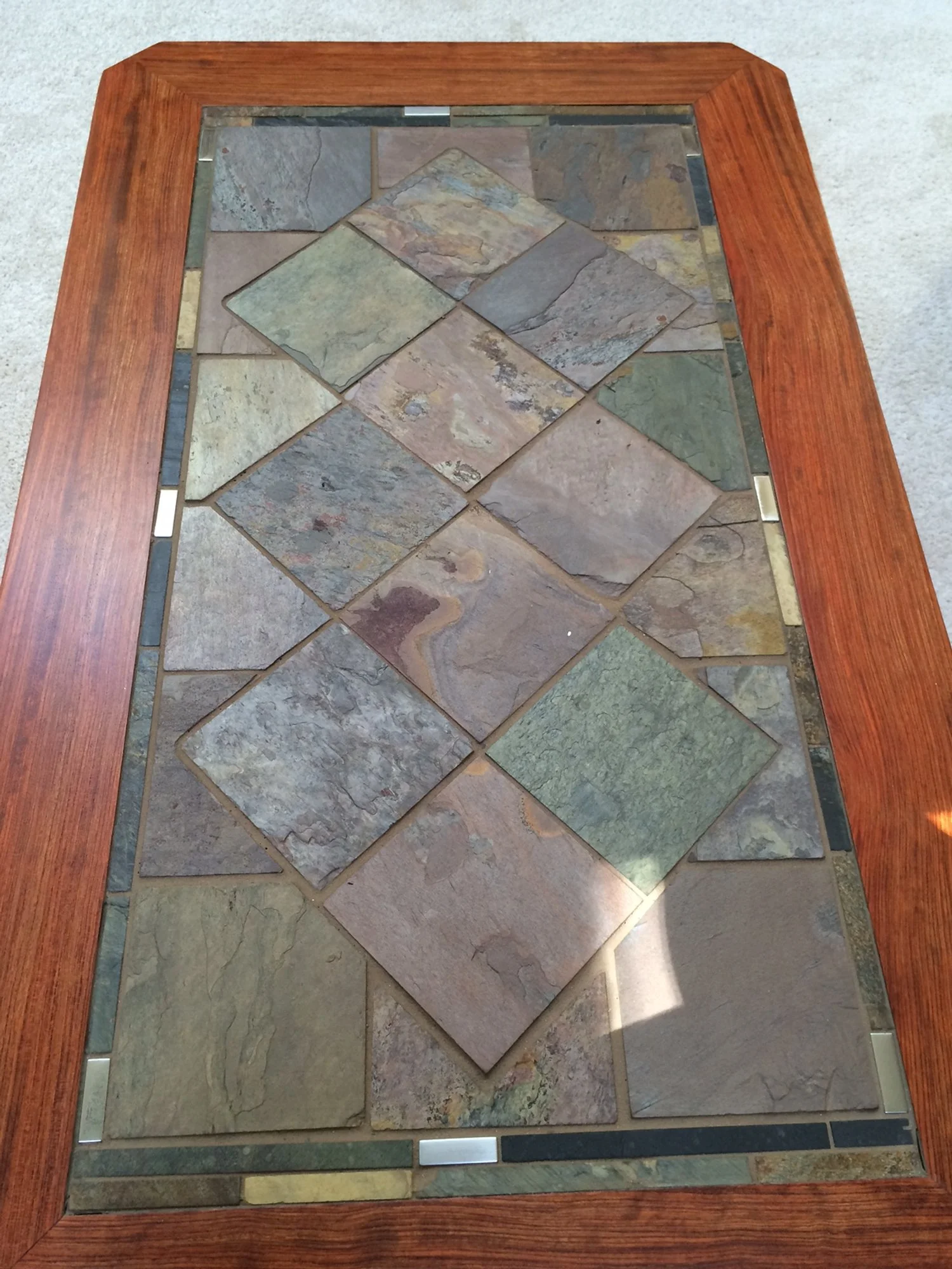 Solid bubinga coffee and end tables inlaid with stone tiles