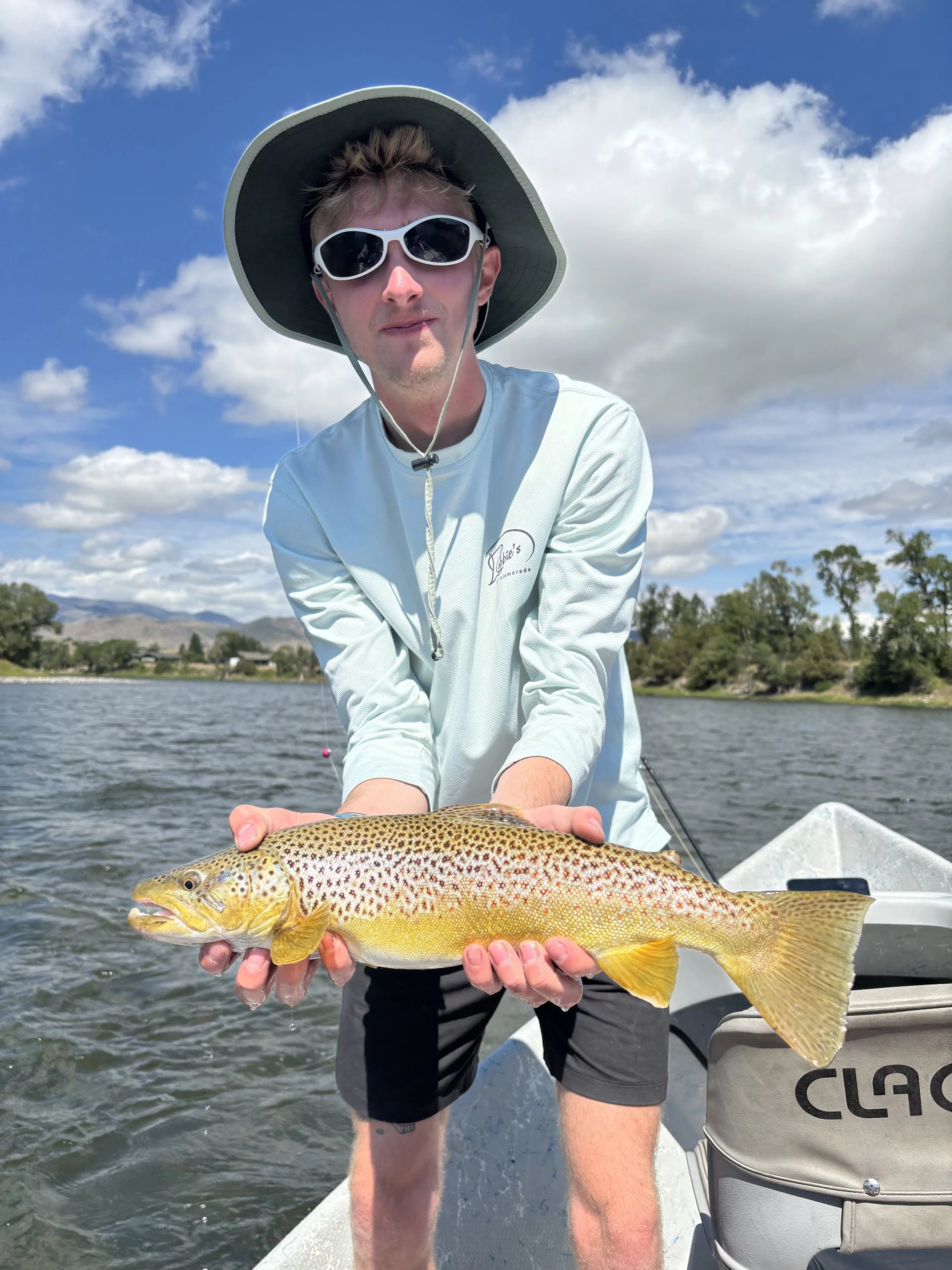 Fly fishing client with big trout caught near Bozeman Montana