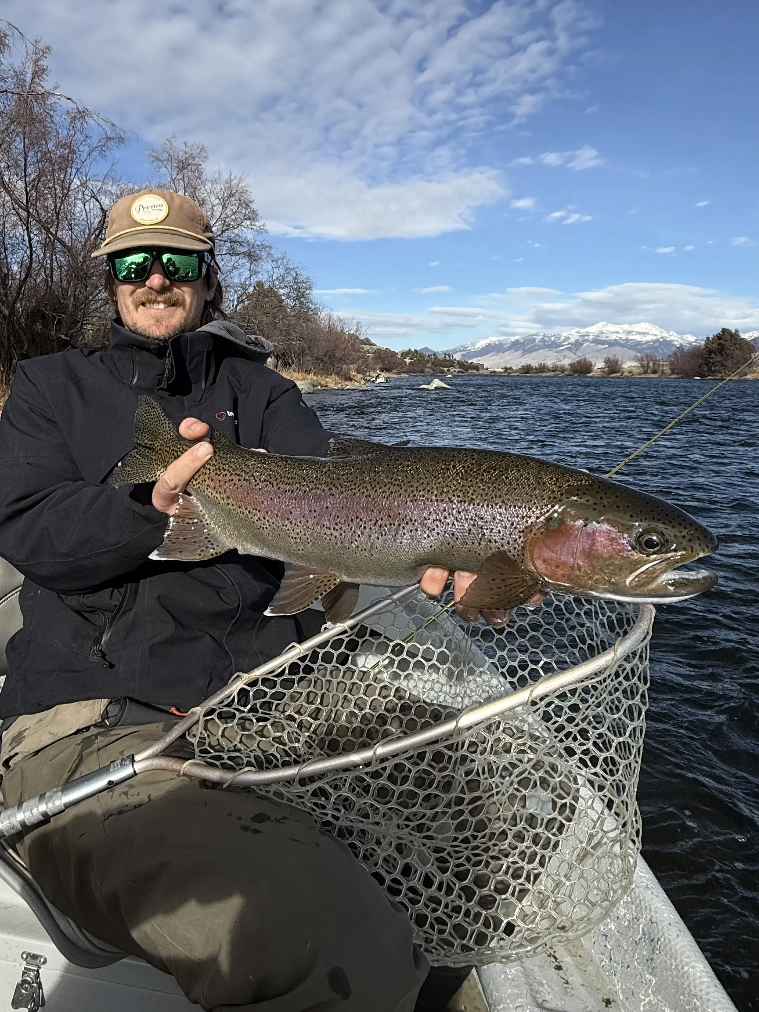 Fly fishing client with big trout caught near Bozeman Montana