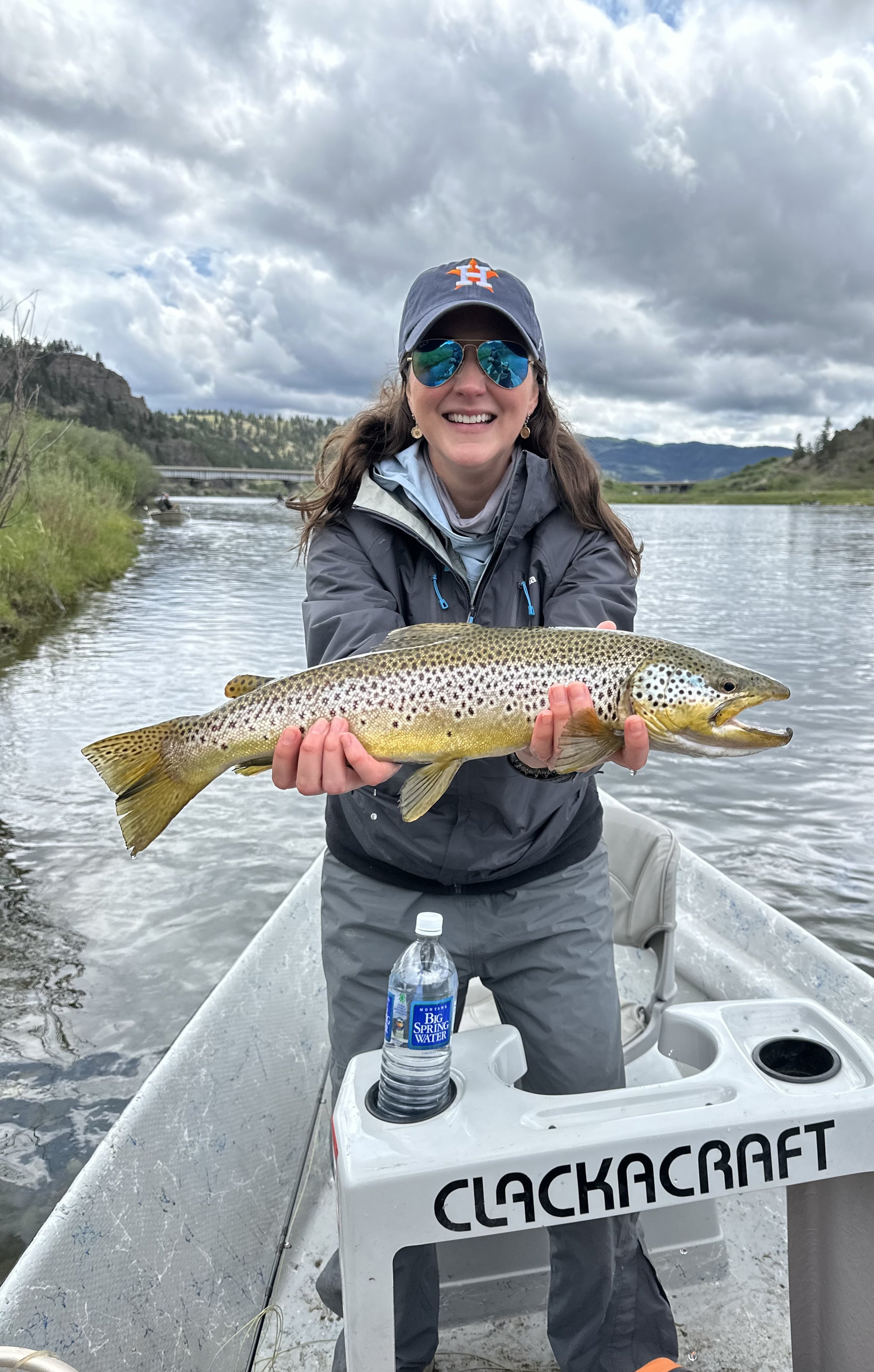 Client with a big brown trout caught on the Missouri River on a guided fly fishing trip