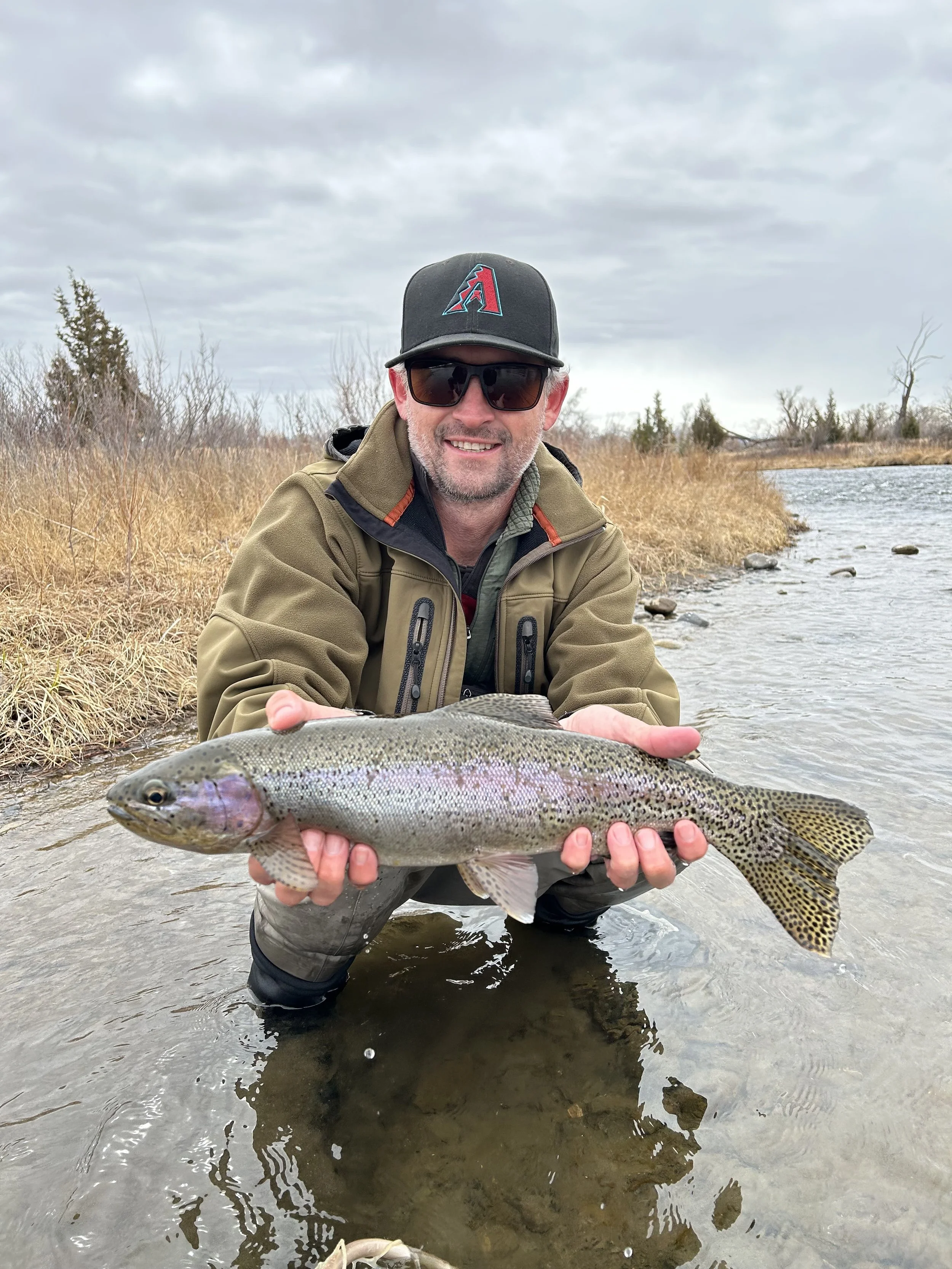 Large rainbow trout caught by a client on an early spring fly fishing trip in Bozeman Montana on the Madison River