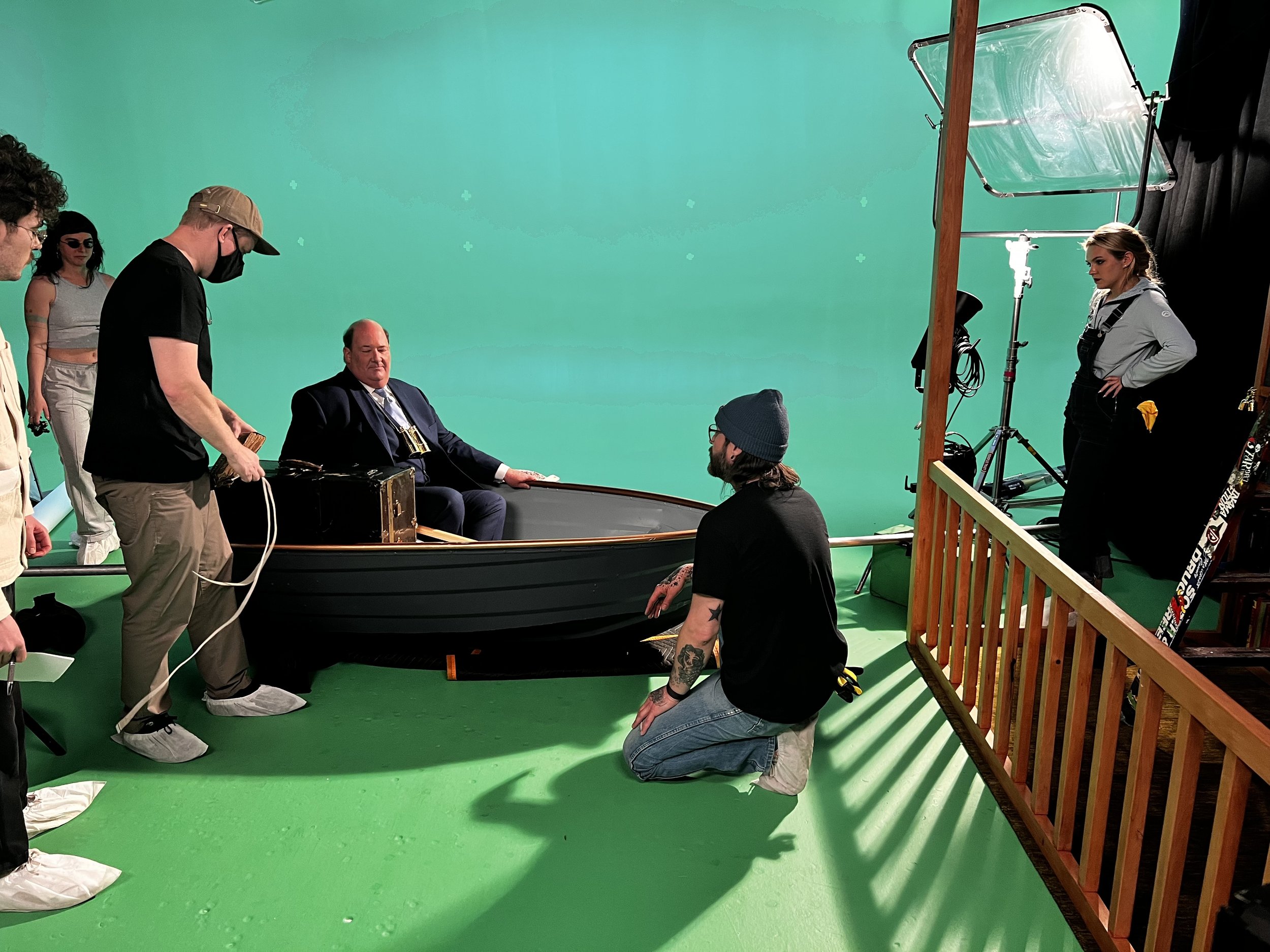 In between takes working with the director (Jake Schumacher), grips, production designer, and actor (Brian Baumgartner).