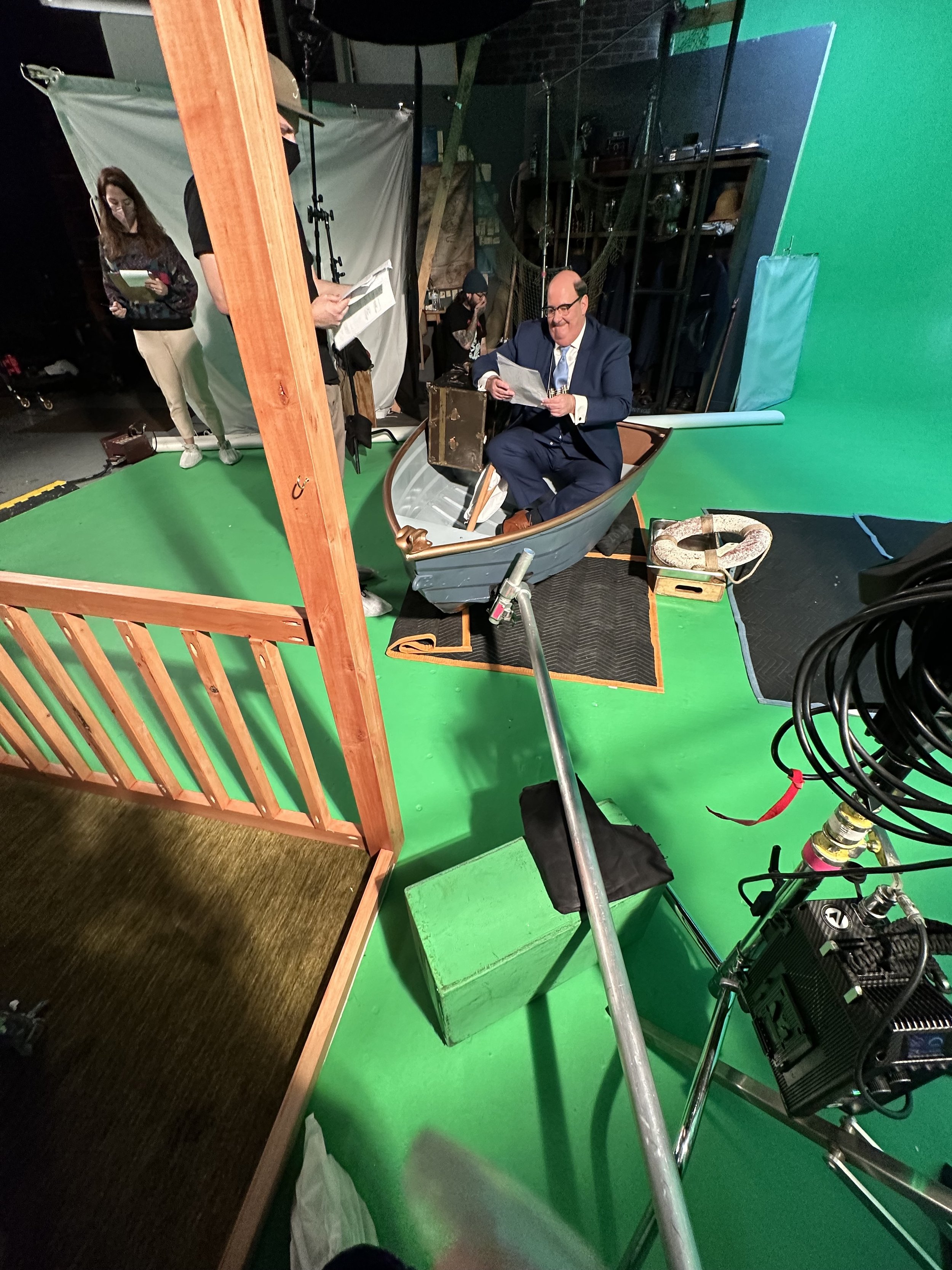 In-between takes adjusting the props and set while working with practical effects.