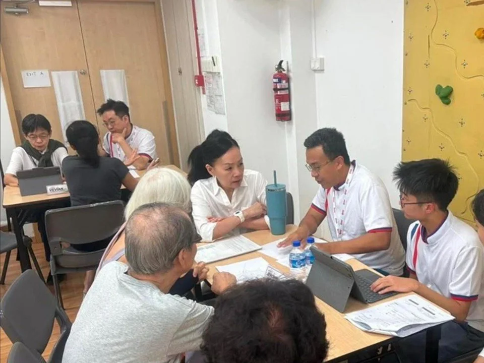 Jerome, residents and MP Rachel Ong at the table during a weekly Meet-the-People Session in Telok Blangah.