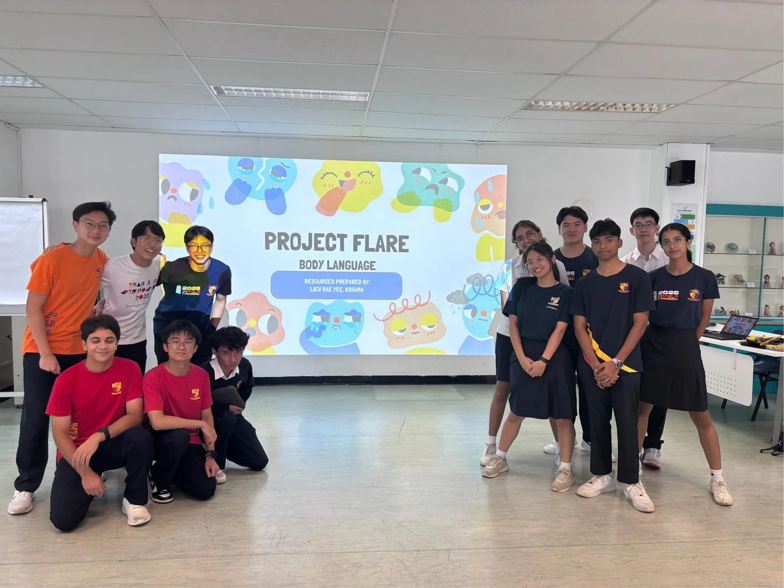 Student volunteers in a classroom preparing to start Project Flare workshop.