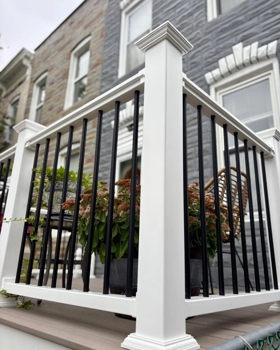 Avalon finished this new front porch using aluminum balusters and PVC posts and railings. These composite decking boards were selected by the client. We worked closely with the homeowner to help them choose the best materials, sizing, and colors for 