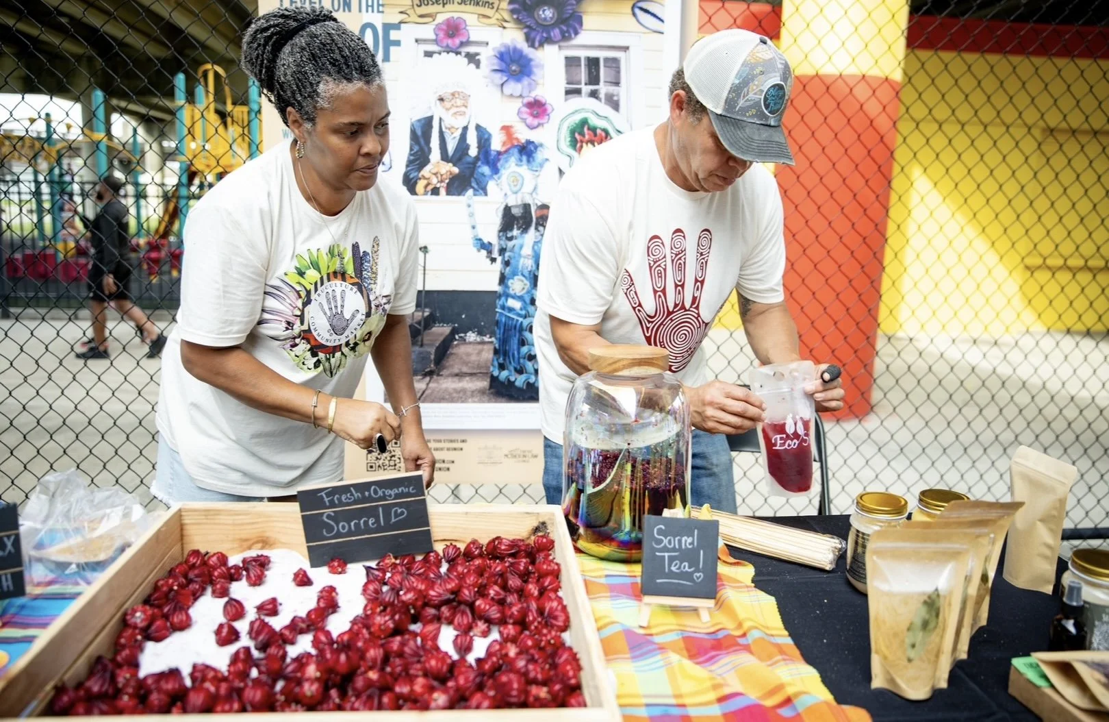From above hands of unrecognizable woman rubbing aromatic spices into piece of raw meat over parchment paper