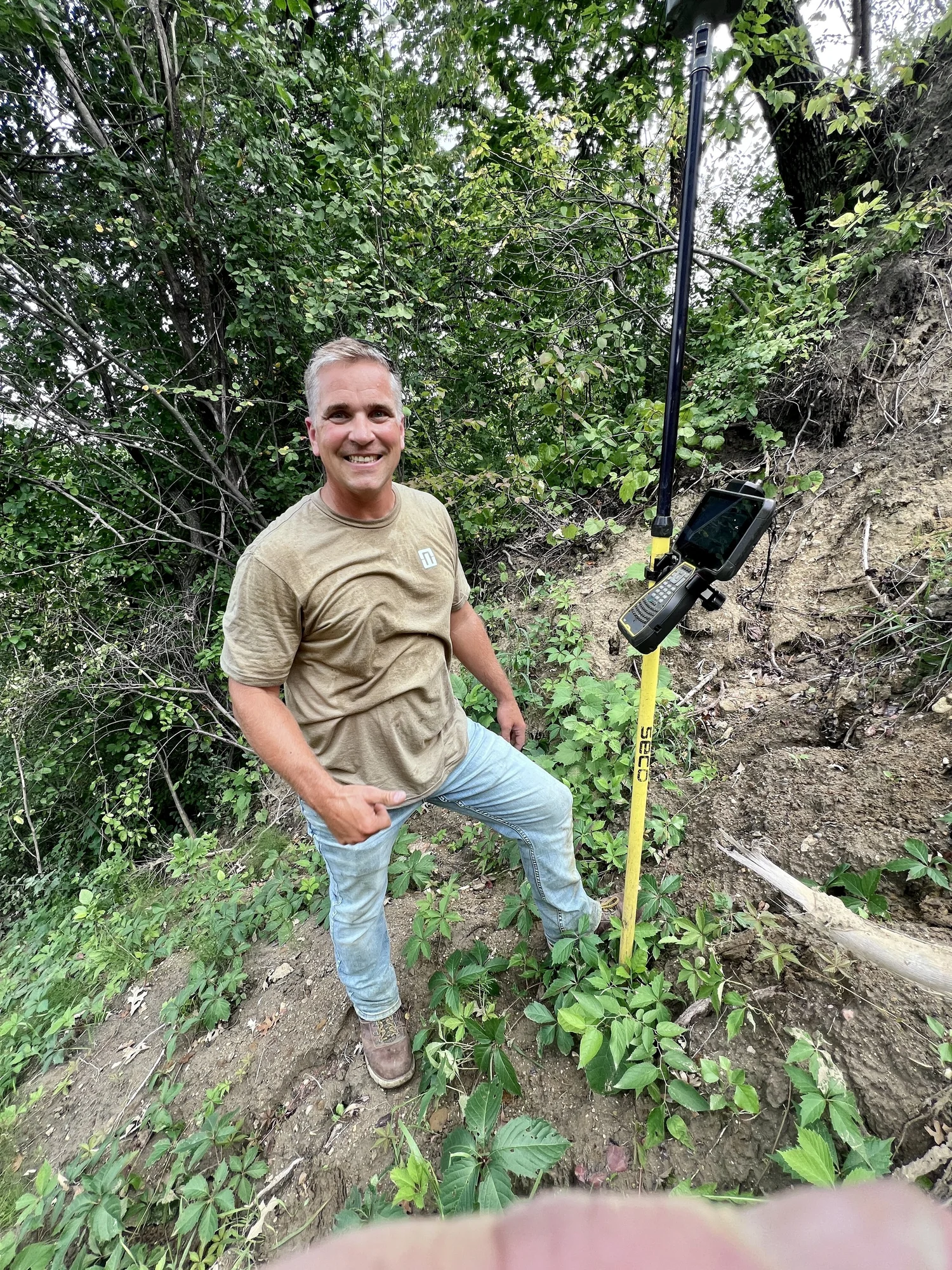 GNSS rover on a survey pole in the field