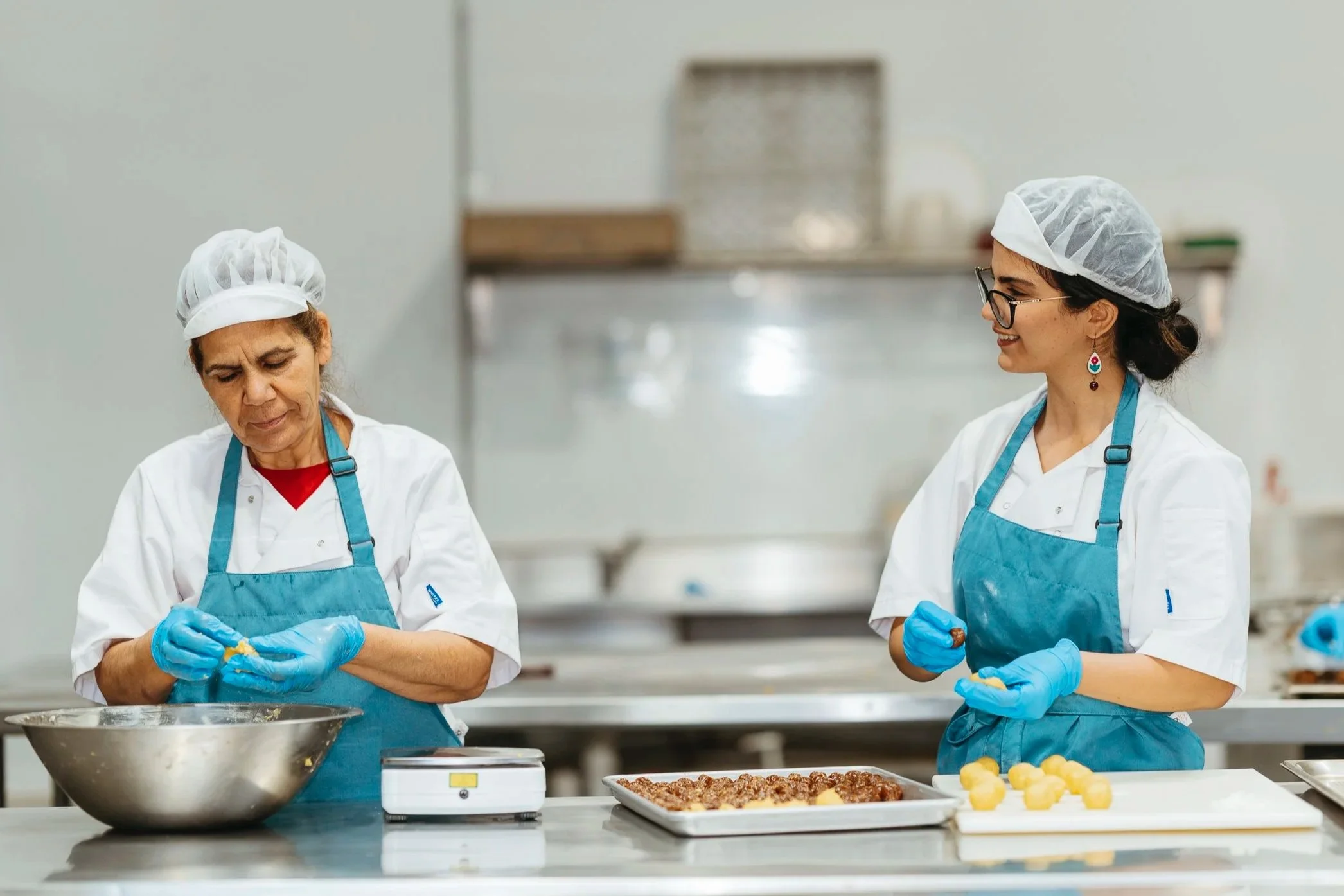 Leva and Her mum Ashraf making kolompe and ghotab authentic Persian sweets in Australia