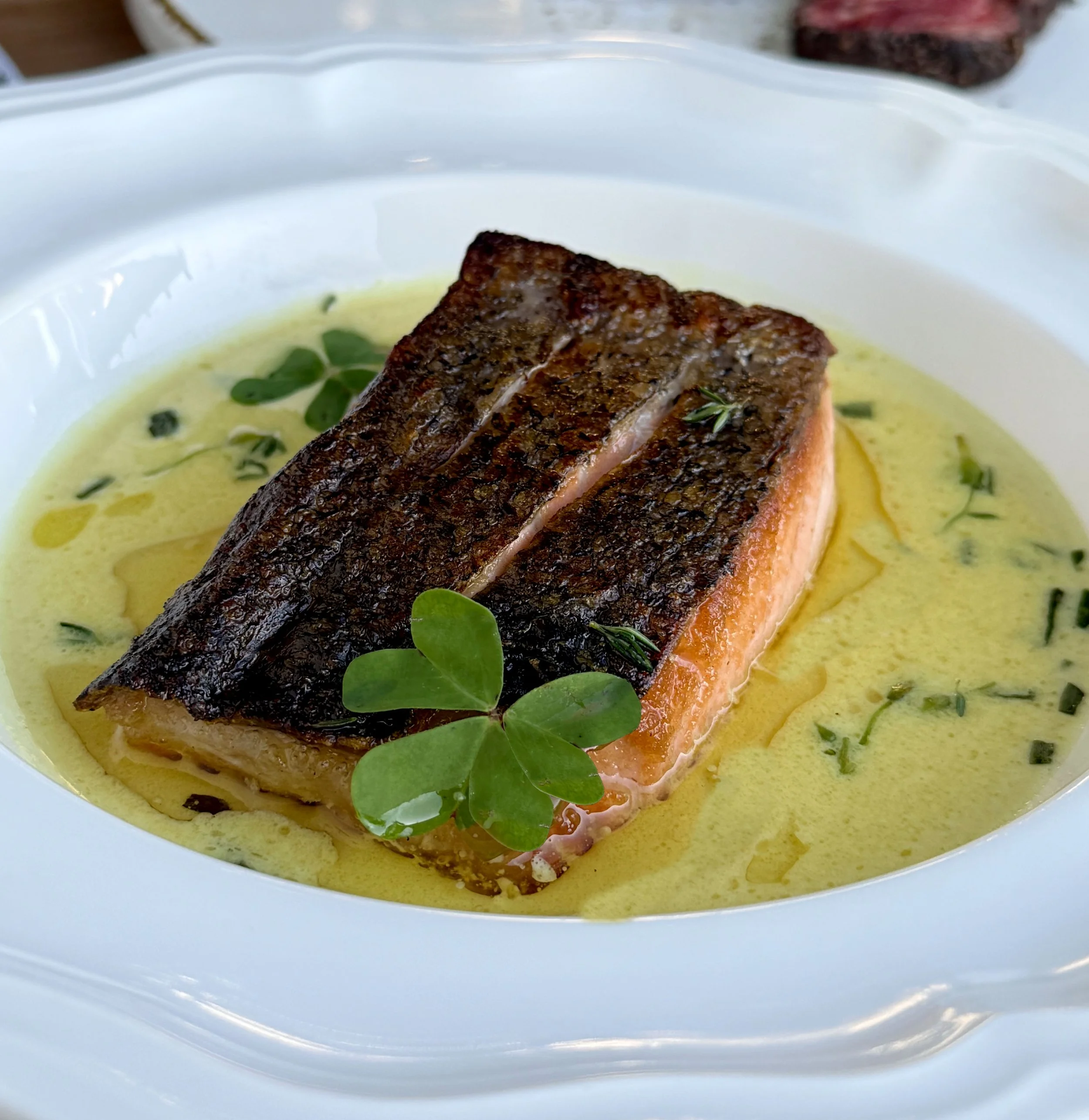Chilean salmon with vermouth beurre blanc and tarragon, served as a gluten-free seafood dish at Restaurant Terratorry