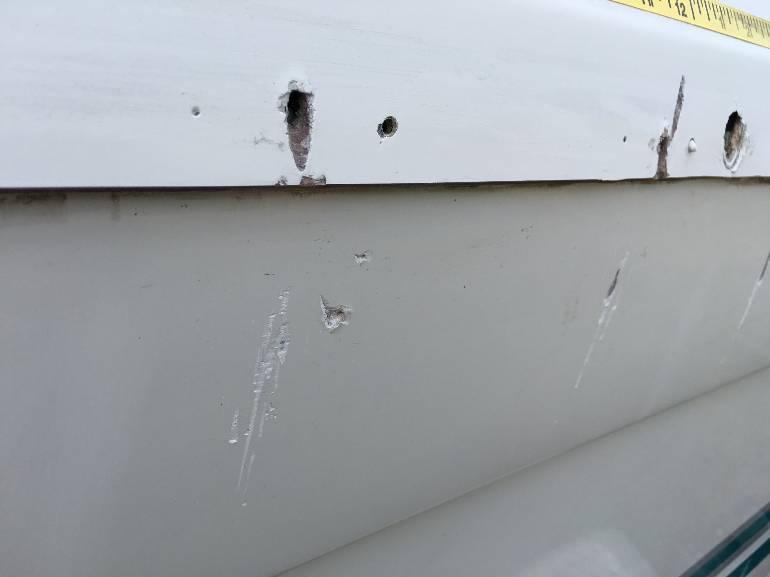 Storm damage. The rub rail was ripped from the boat and then repeatedly push back into the side.