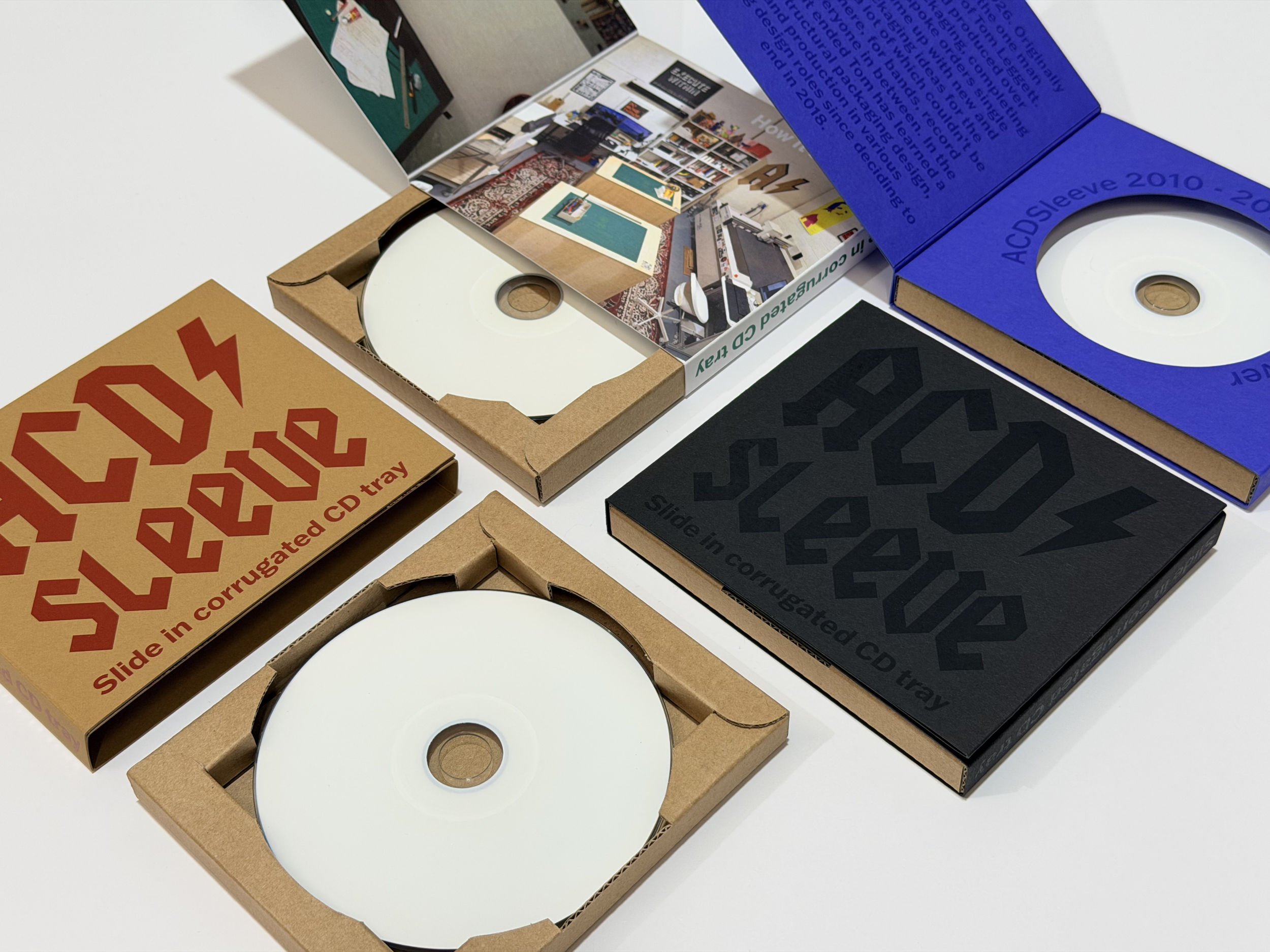Slide in corrugated CD tray