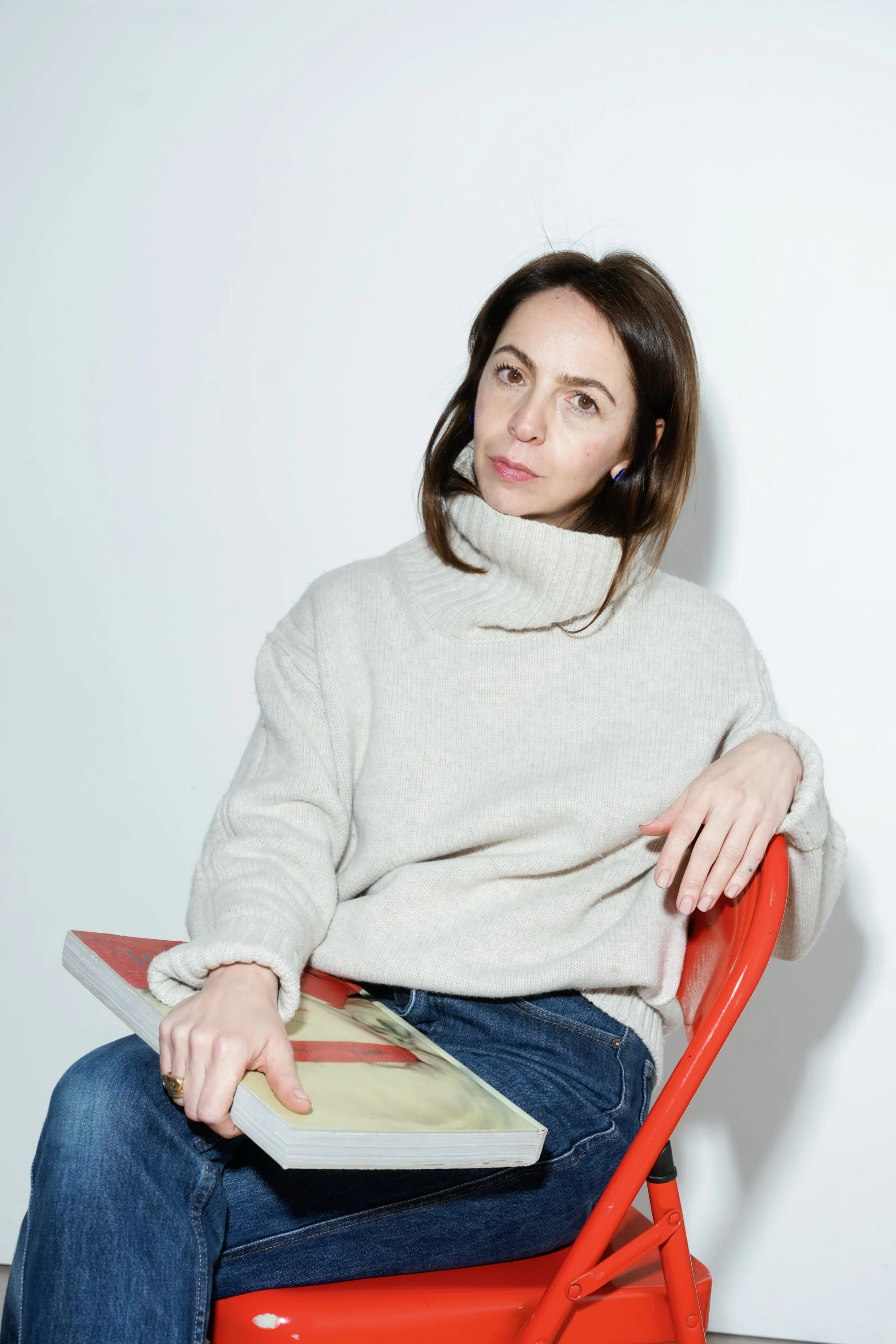 Gianna, personal stylist in London, working on a client’s wardrobe rails