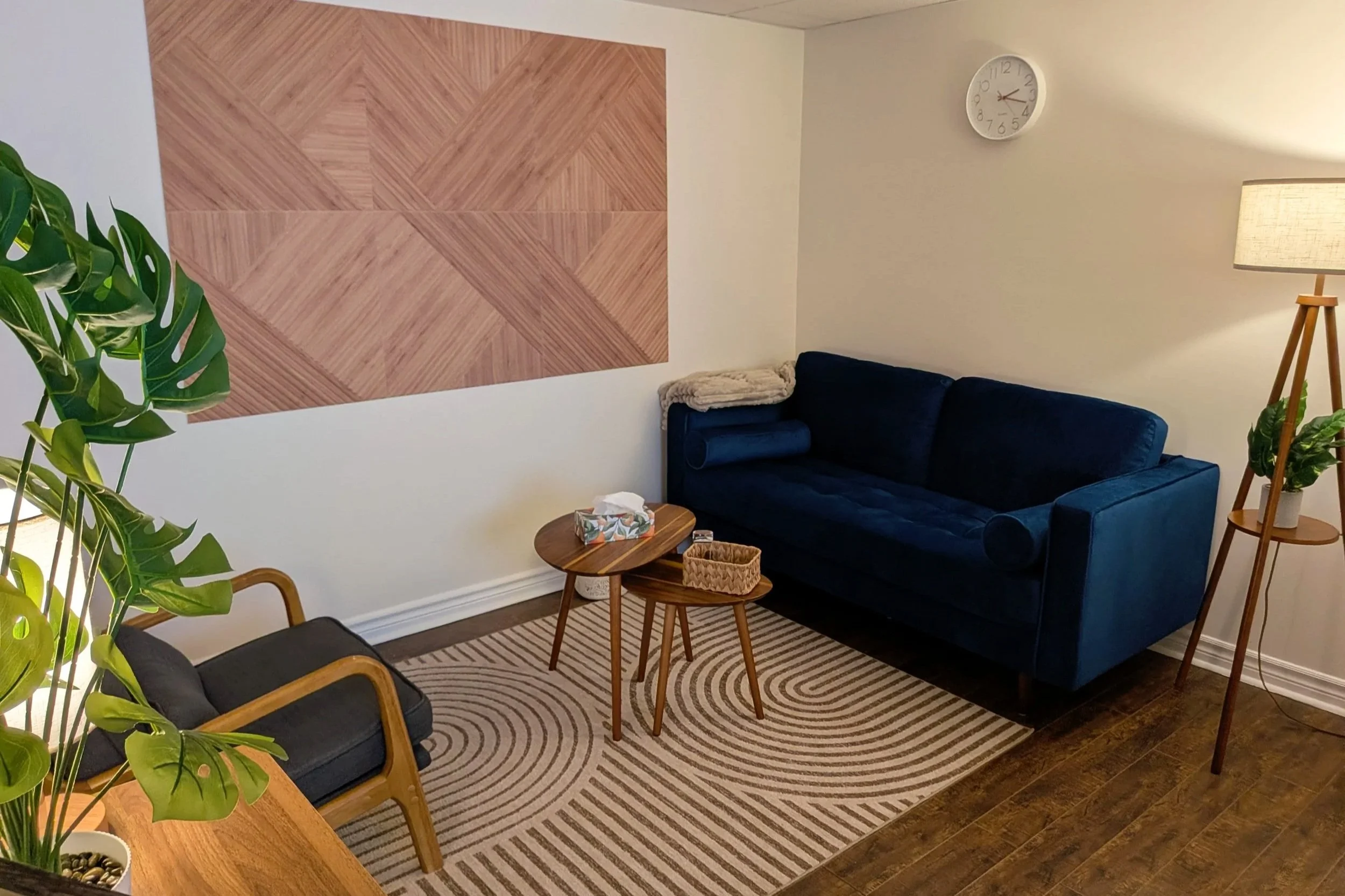 Blue therapeutic room at Root Bloom Thrive, a mental health clinic comprised of therapists and a Registered Dietitian in Sudbury, Ontario.